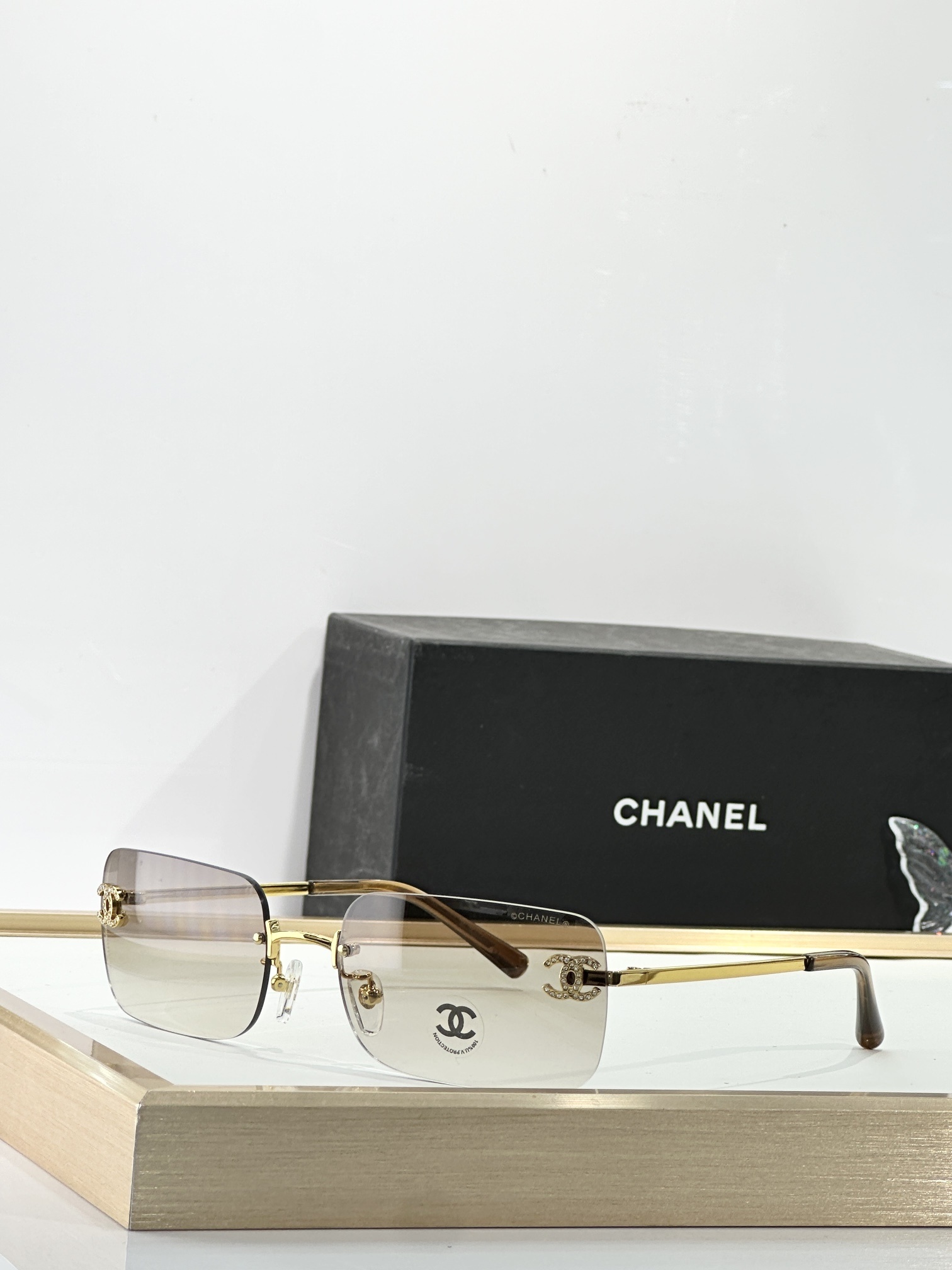 Chanel Luxury Rimless Sunglasses with Rhinestone CC Logo
