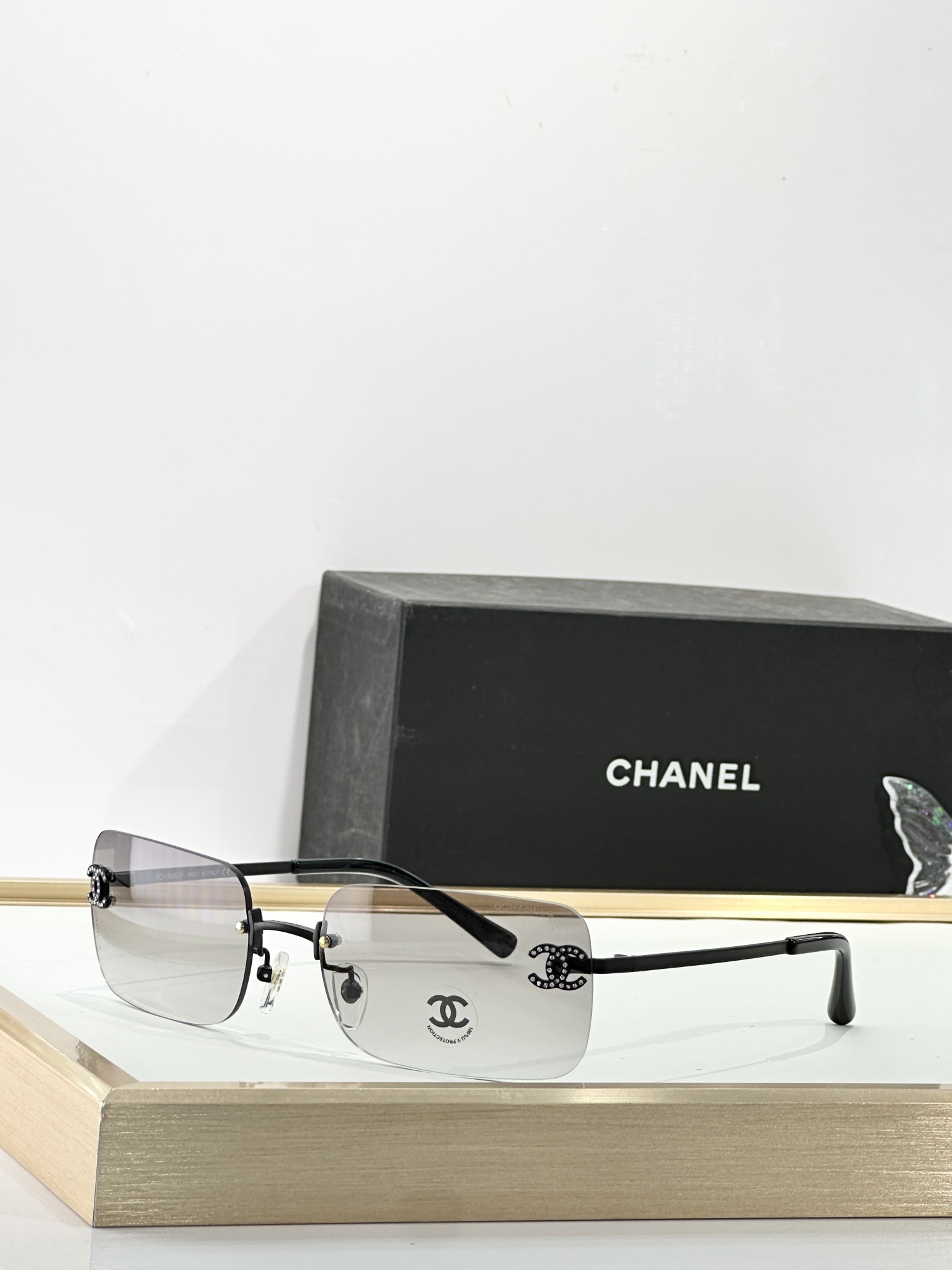 Chanel Luxury Rimless Sunglasses with Rhinestone CC Logo
