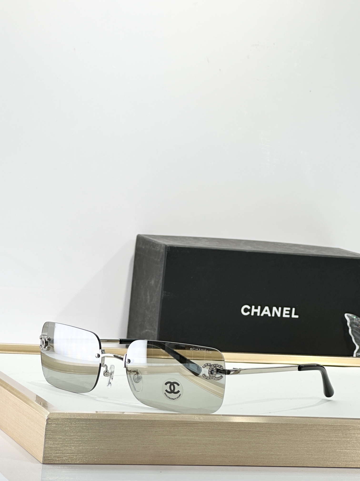 Chanel Luxury Rimless Sunglasses with Rhinestone CC Logo
