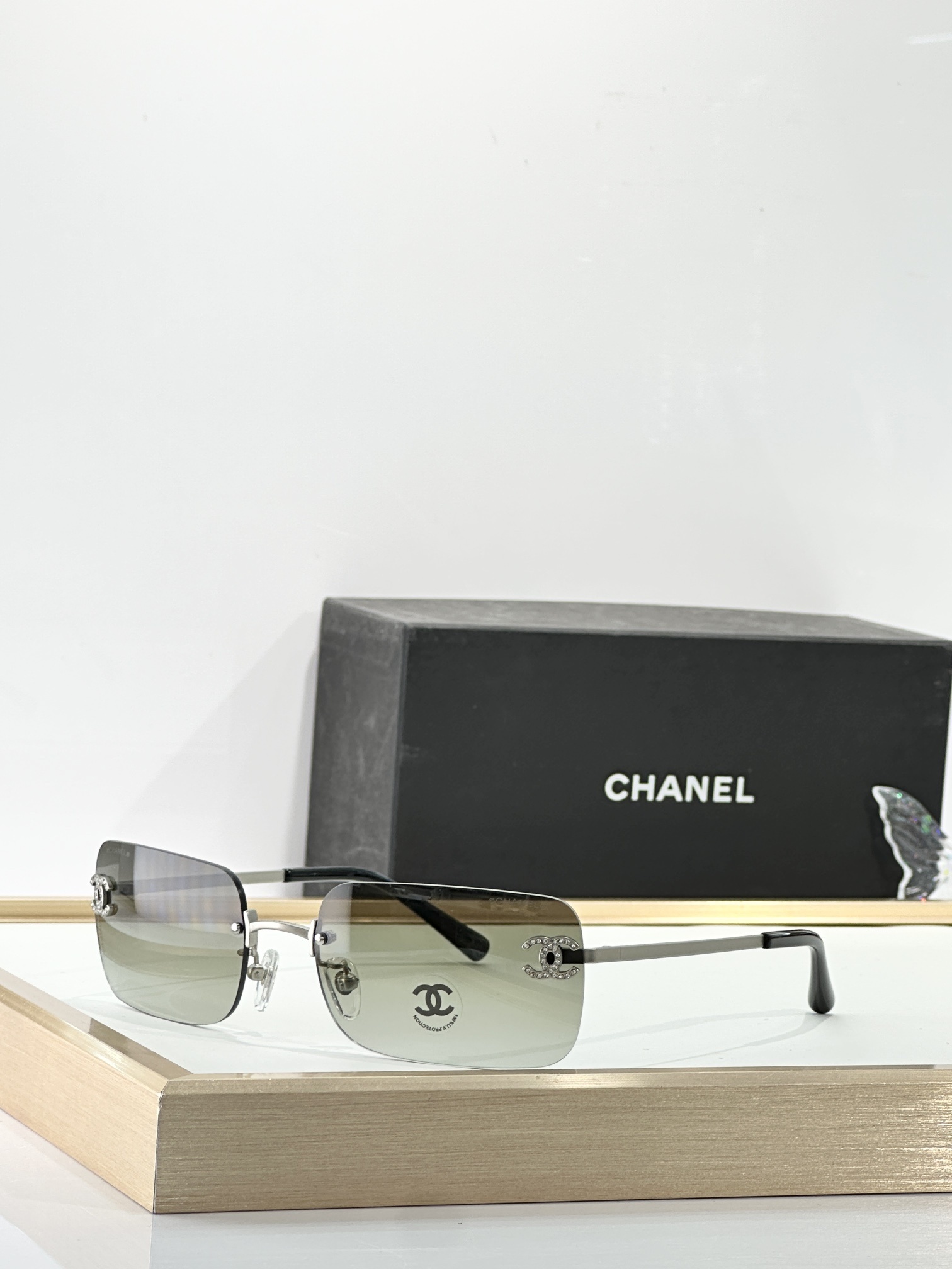 Chanel Luxury Rimless Sunglasses with Rhinestone CC Logo