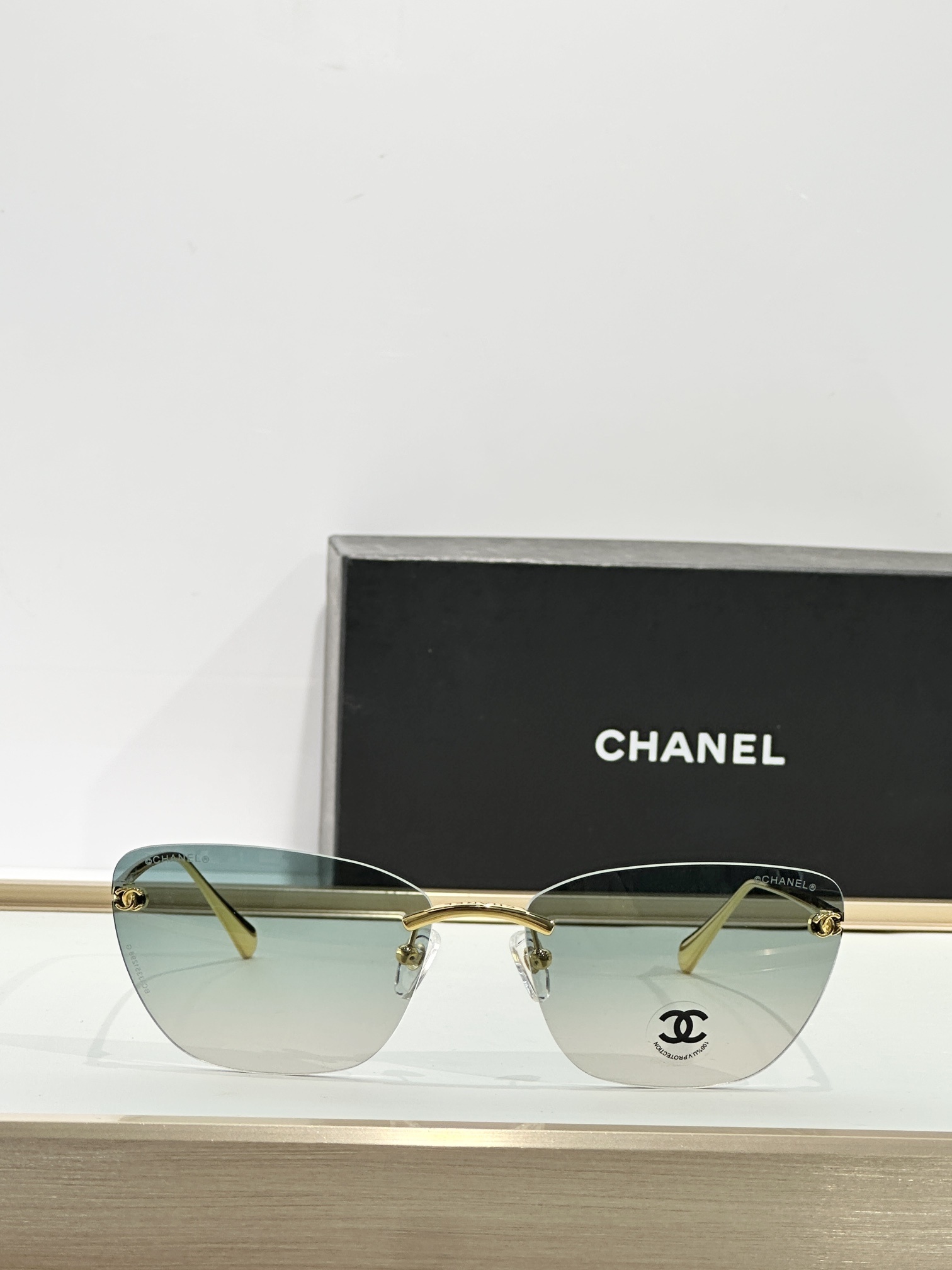 Chanel Luxury Rimless Butterfly Sunglasses - Gold & Gradient Blue