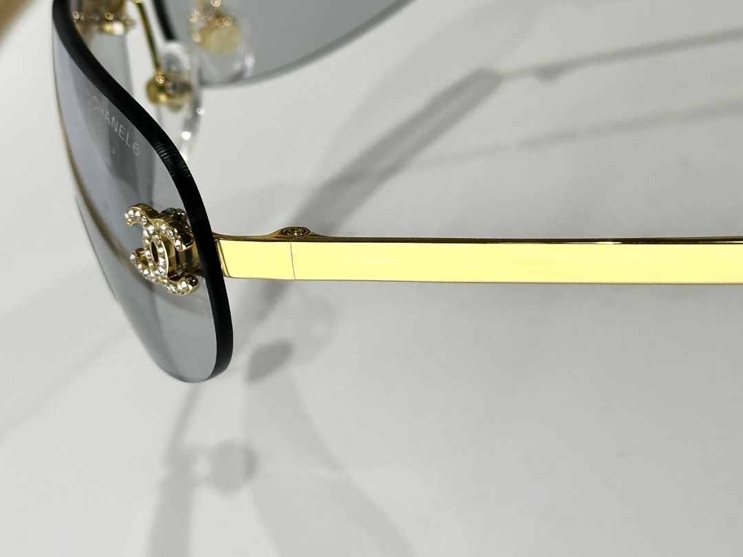 Chanel Rimless Oval Sunglasses - Gold & Crystal CC Logo