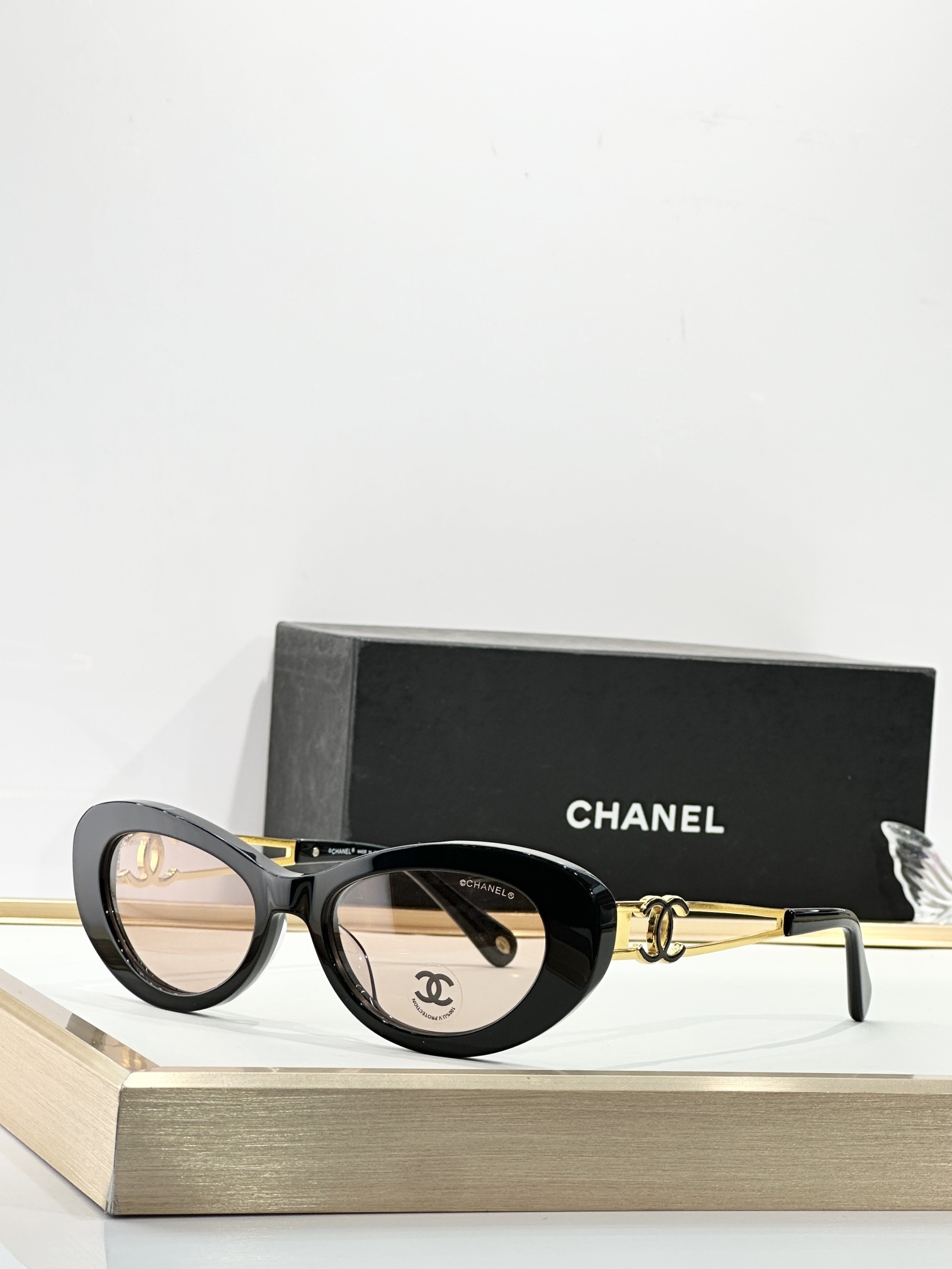 Chanel Luxury Cat-Eye Sunglasses with Gold-Tone CC Logo Temples