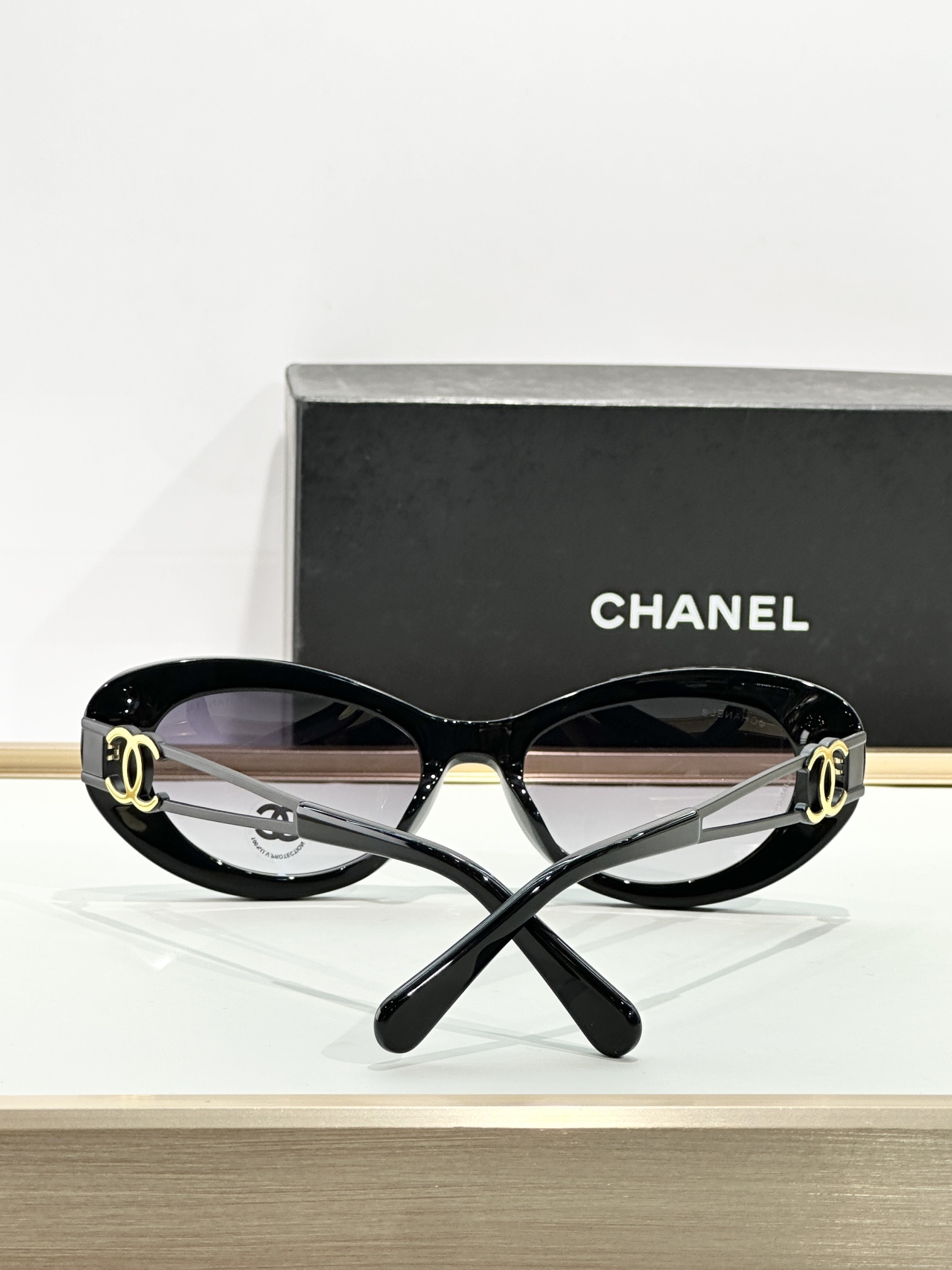 Chanel Oval Sunglasses - Black Acetate with Gold CC Logo Temples