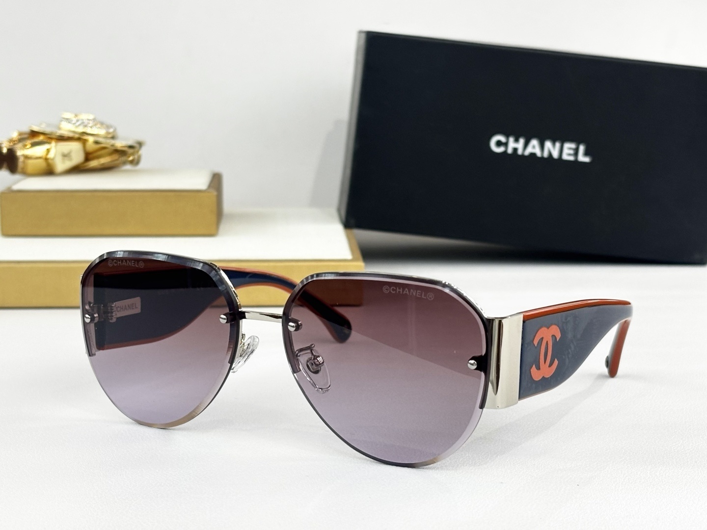 Chanel Luxury Rimless Aviator Sunglasses with CC Logo Temples