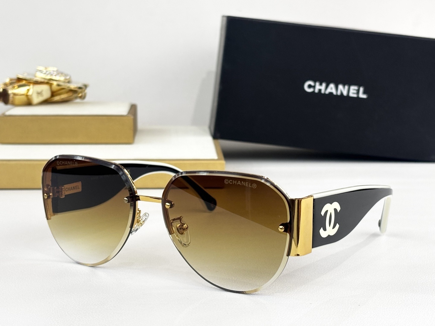 Chanel Luxury Rimless Aviator Sunglasses with CC Logo Temples