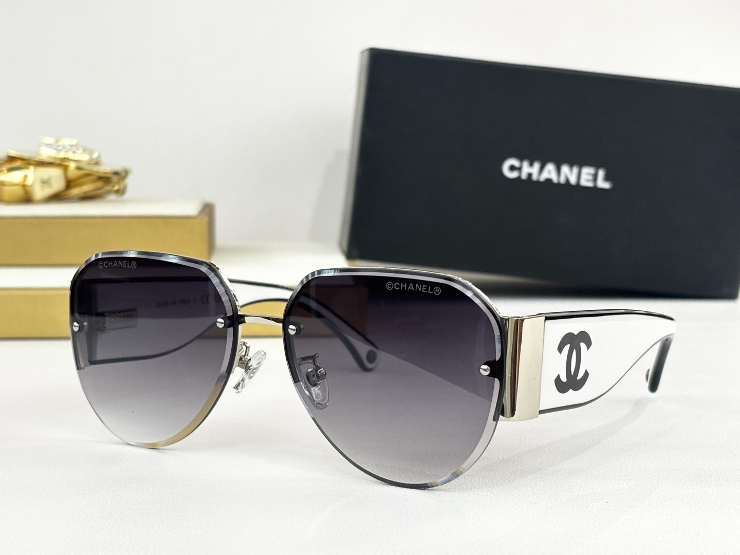 Chanel Luxury Rimless Aviator Sunglasses with CC Logo Temples