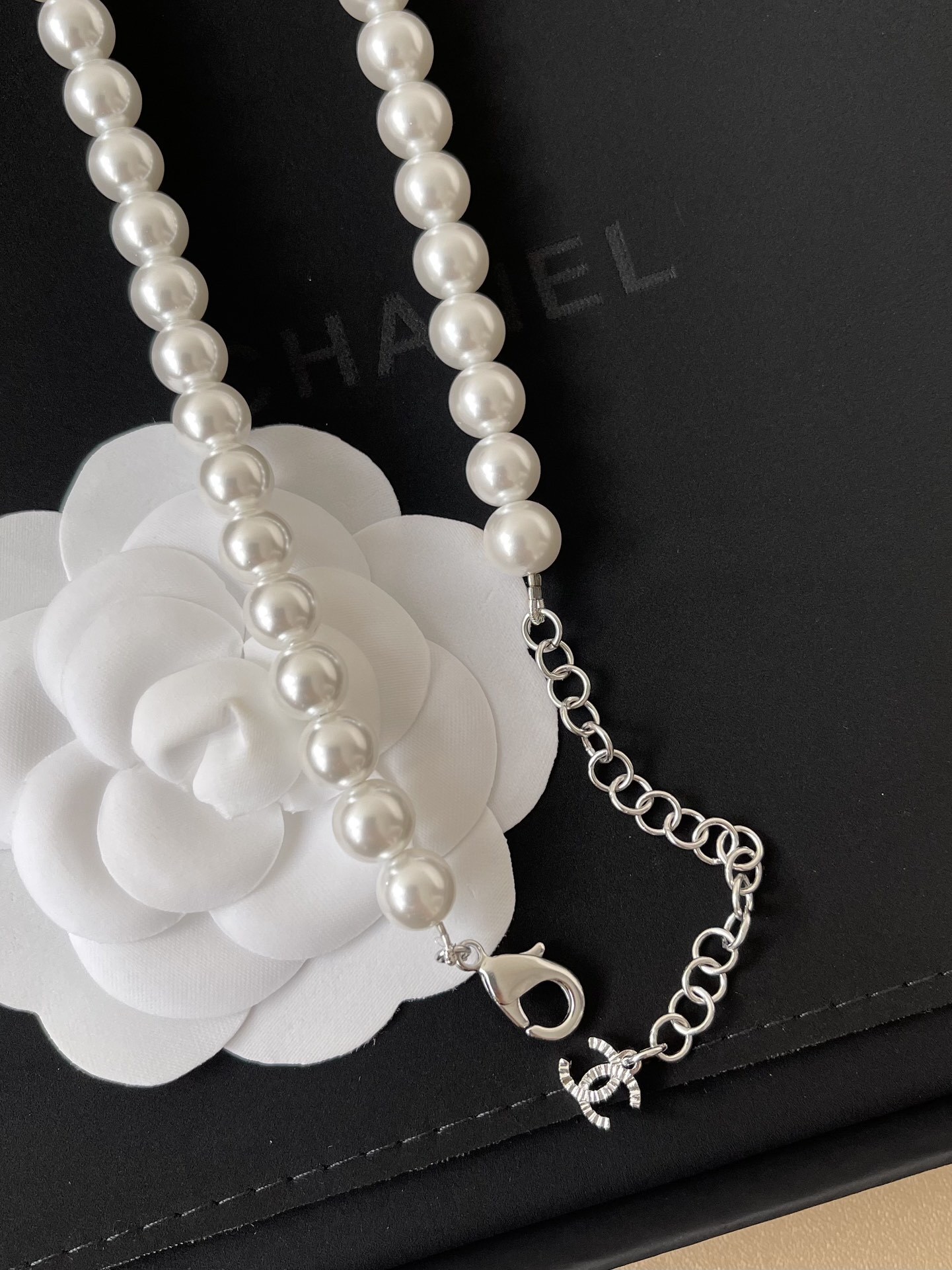 Elegant Long Pearl Necklace with Iconic CC Logo Pendant