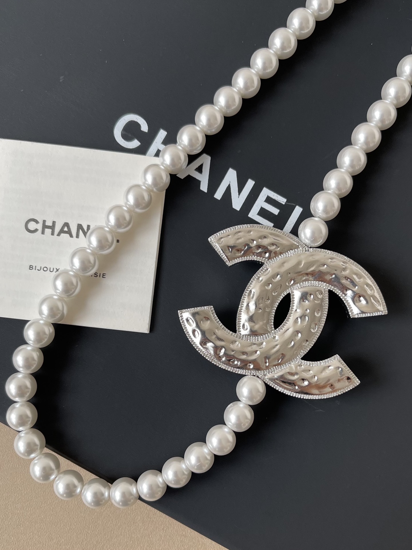 Elegant Long Pearl Necklace with Iconic CC Logo Pendant