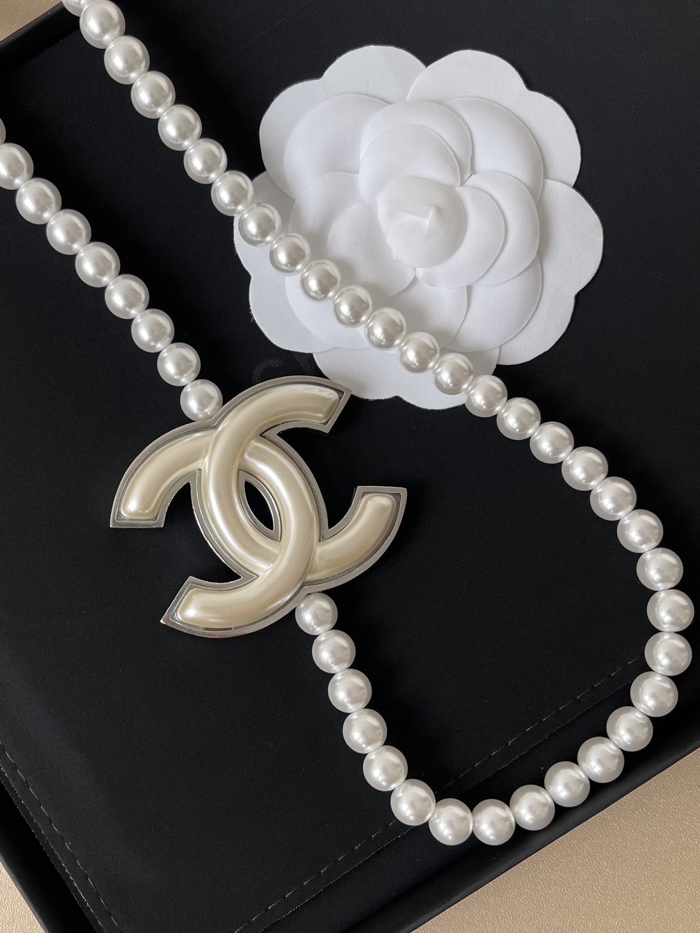 Elegant Long Pearl Necklace with Iconic CC Logo Pendant