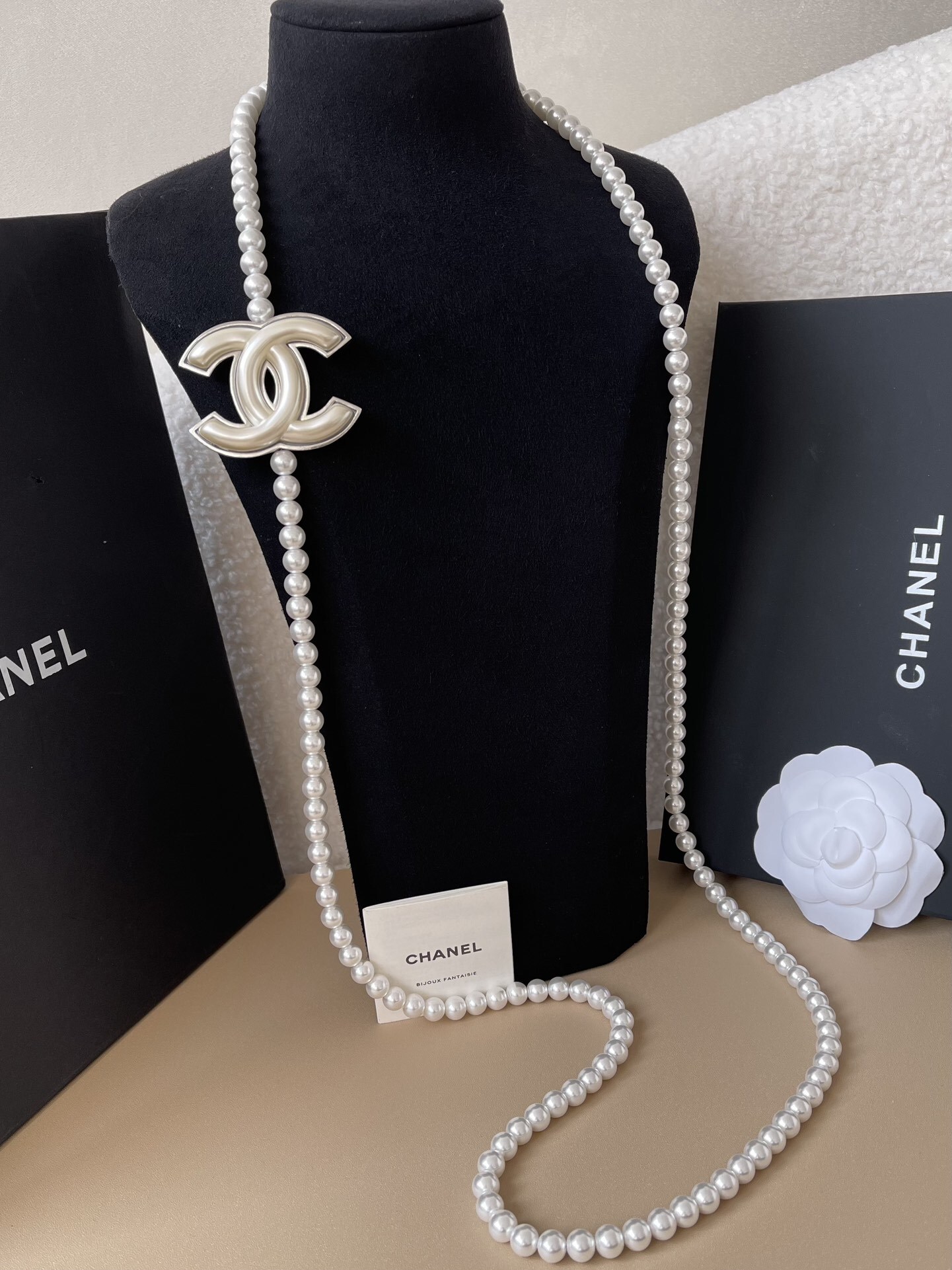 Elegant Long Pearl Necklace with Iconic CC Logo Pendant