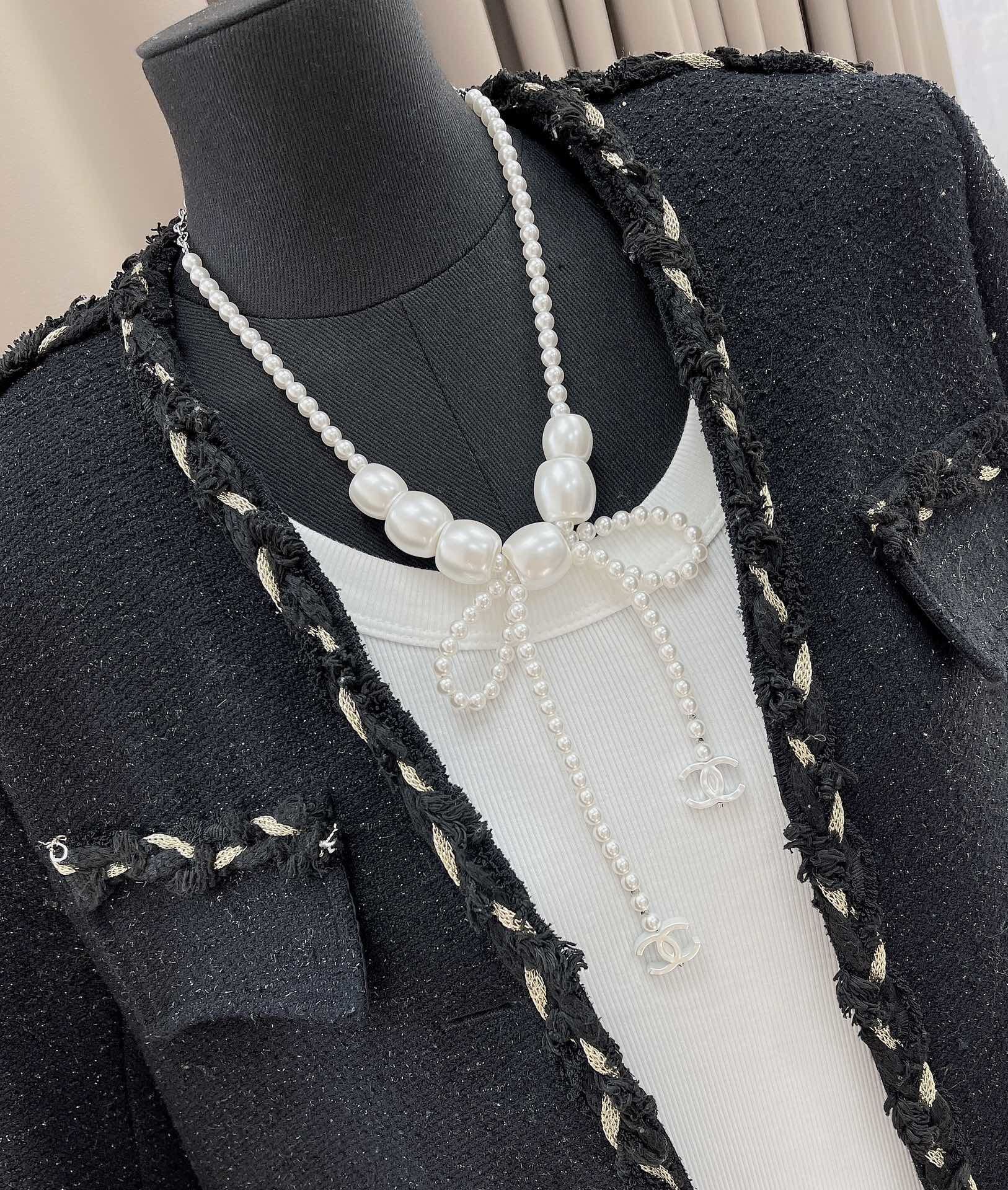Chanel Elegant Pearl Bow Necklace with CC Logo Charms