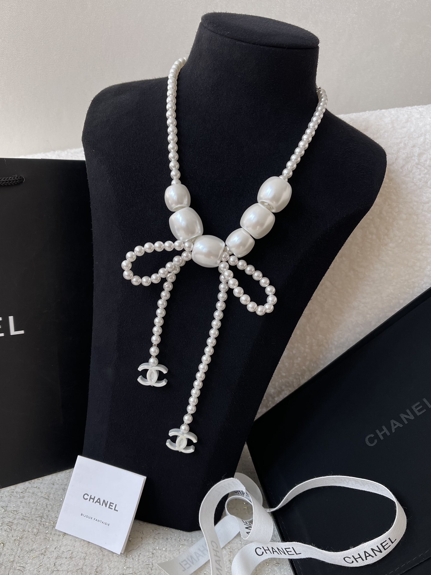 Chanel Elegant Pearl Bow Necklace with CC Logo Charms