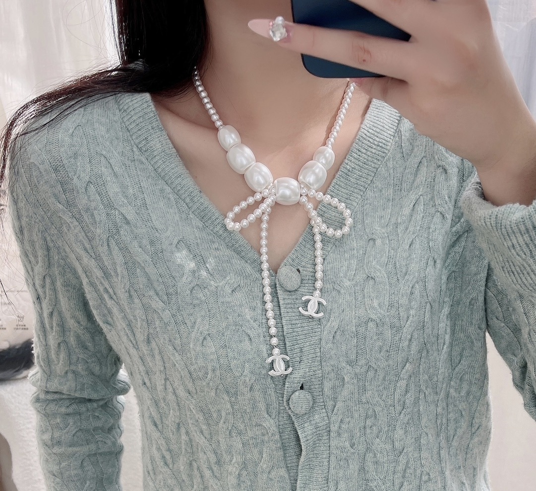 Chanel Elegant Pearl Bow Necklace with CC Logo Charms