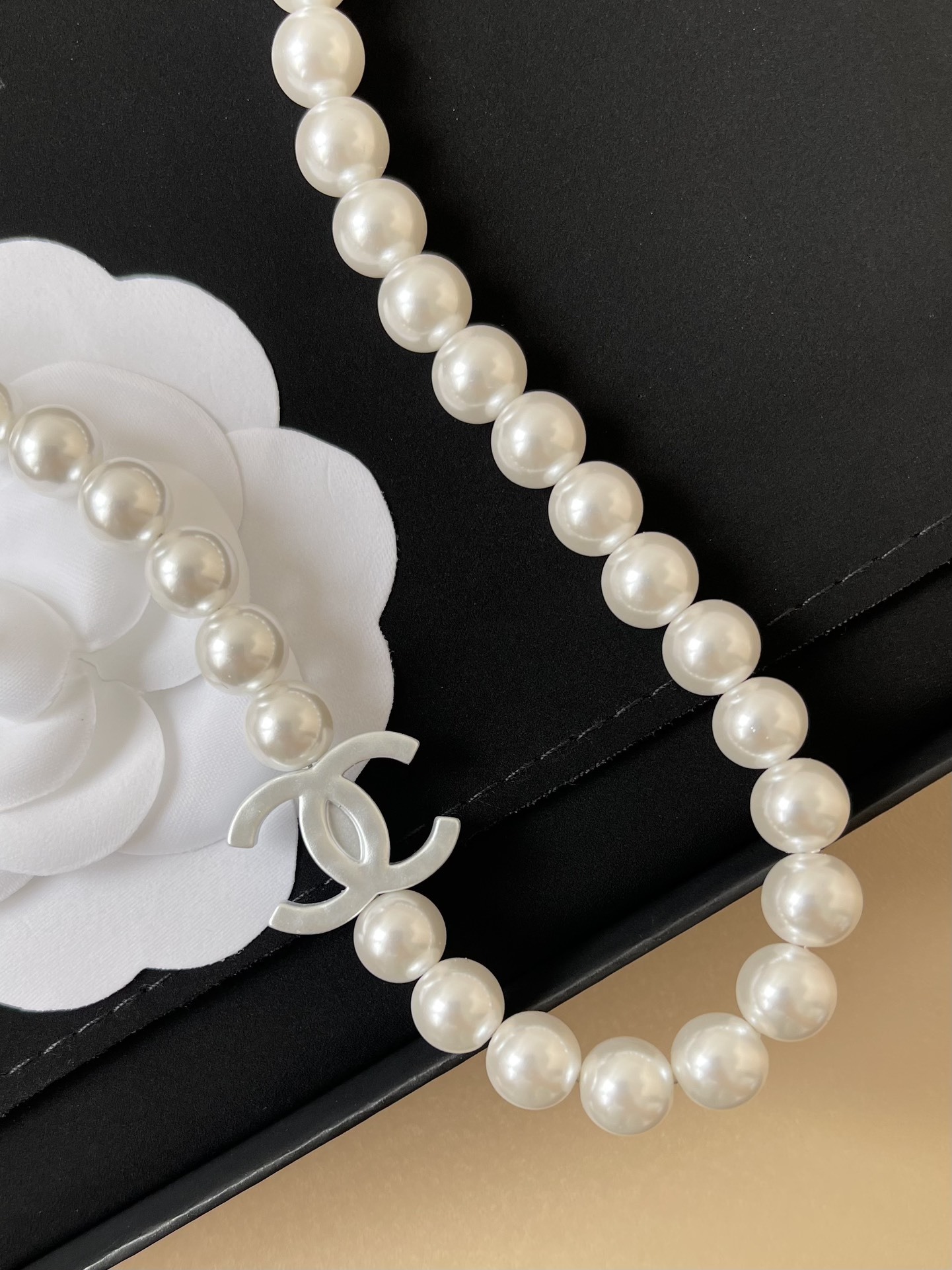 Elegant Pearl Necklace with Iconic CC Logo Charm