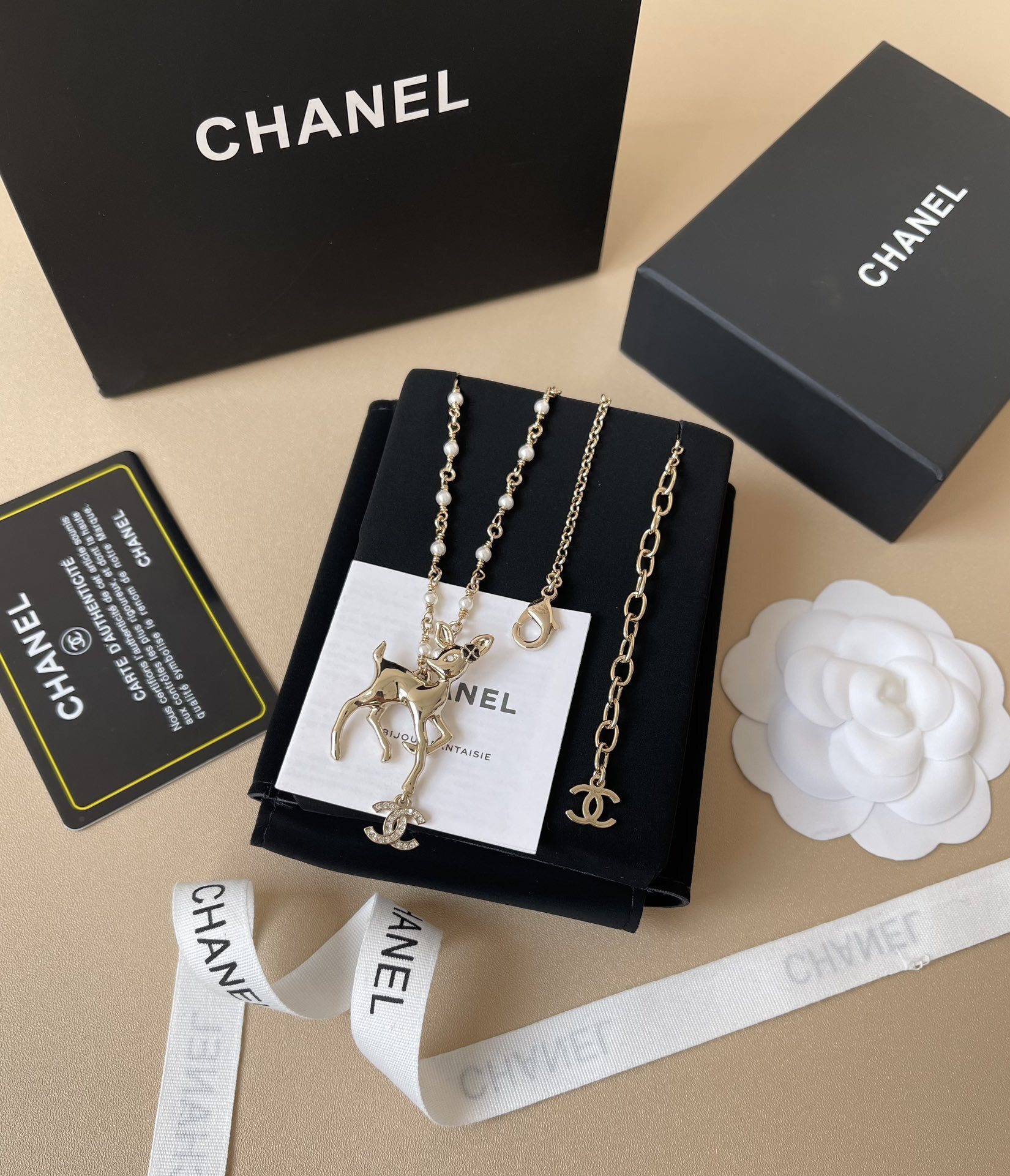 Chanel Gold Fawn Deer Necklace with Pearl Chain and CC Logo
