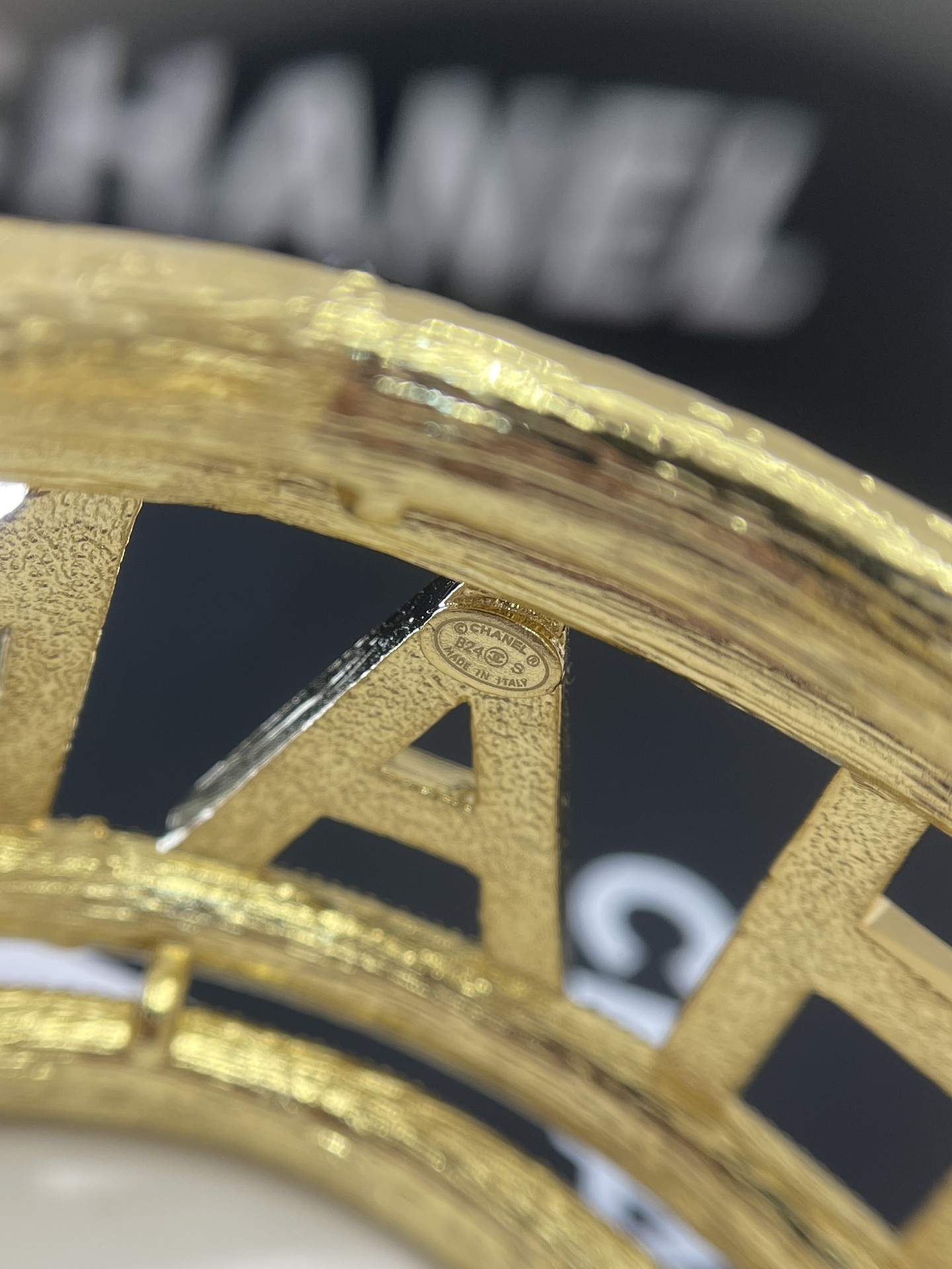 Luxury Chanel Gold-Tone Logo Cuff Bracelet with Black & White Stones