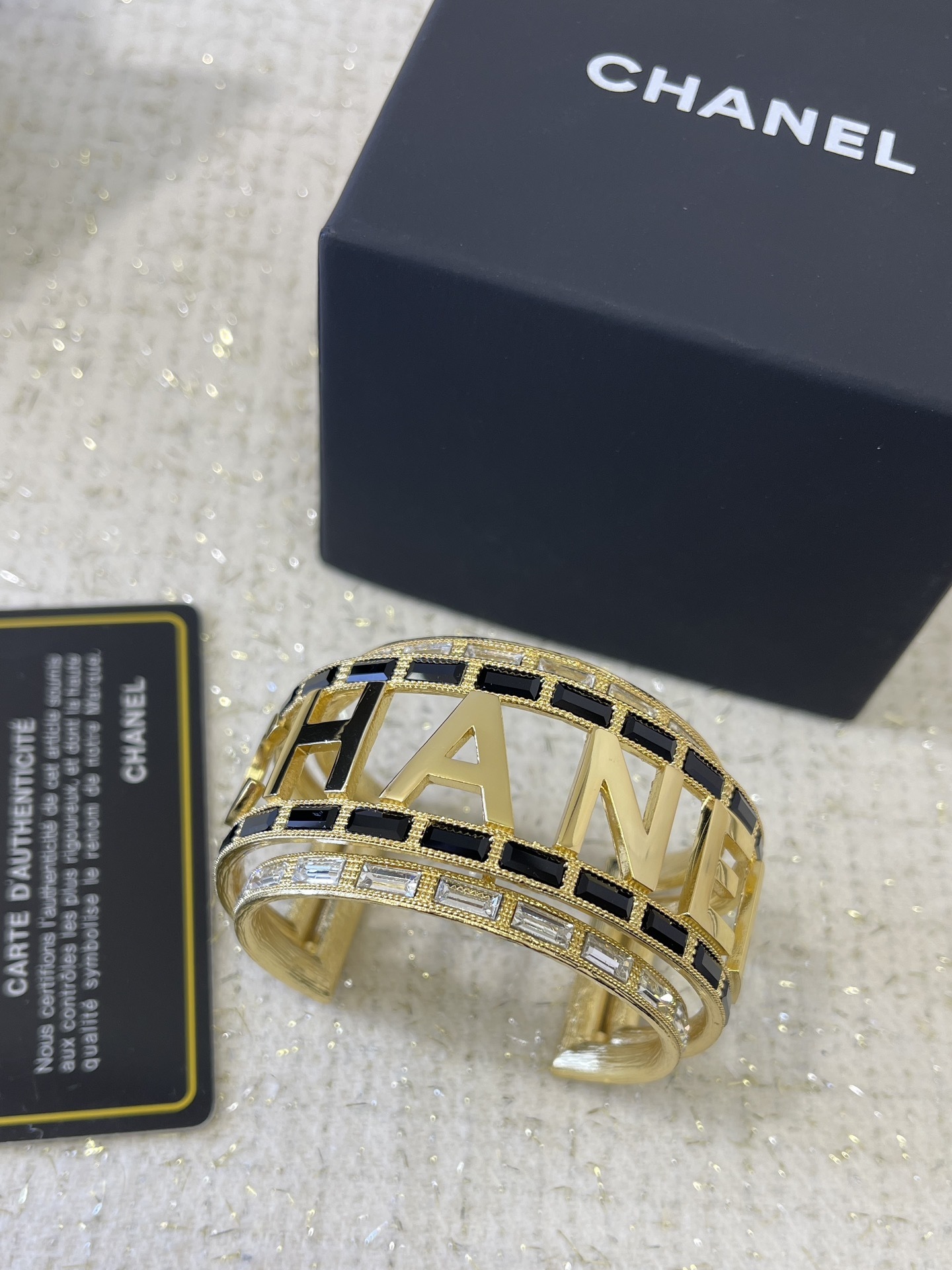 Luxury Chanel Gold-Tone Logo Cuff Bracelet with Black & White Stones
