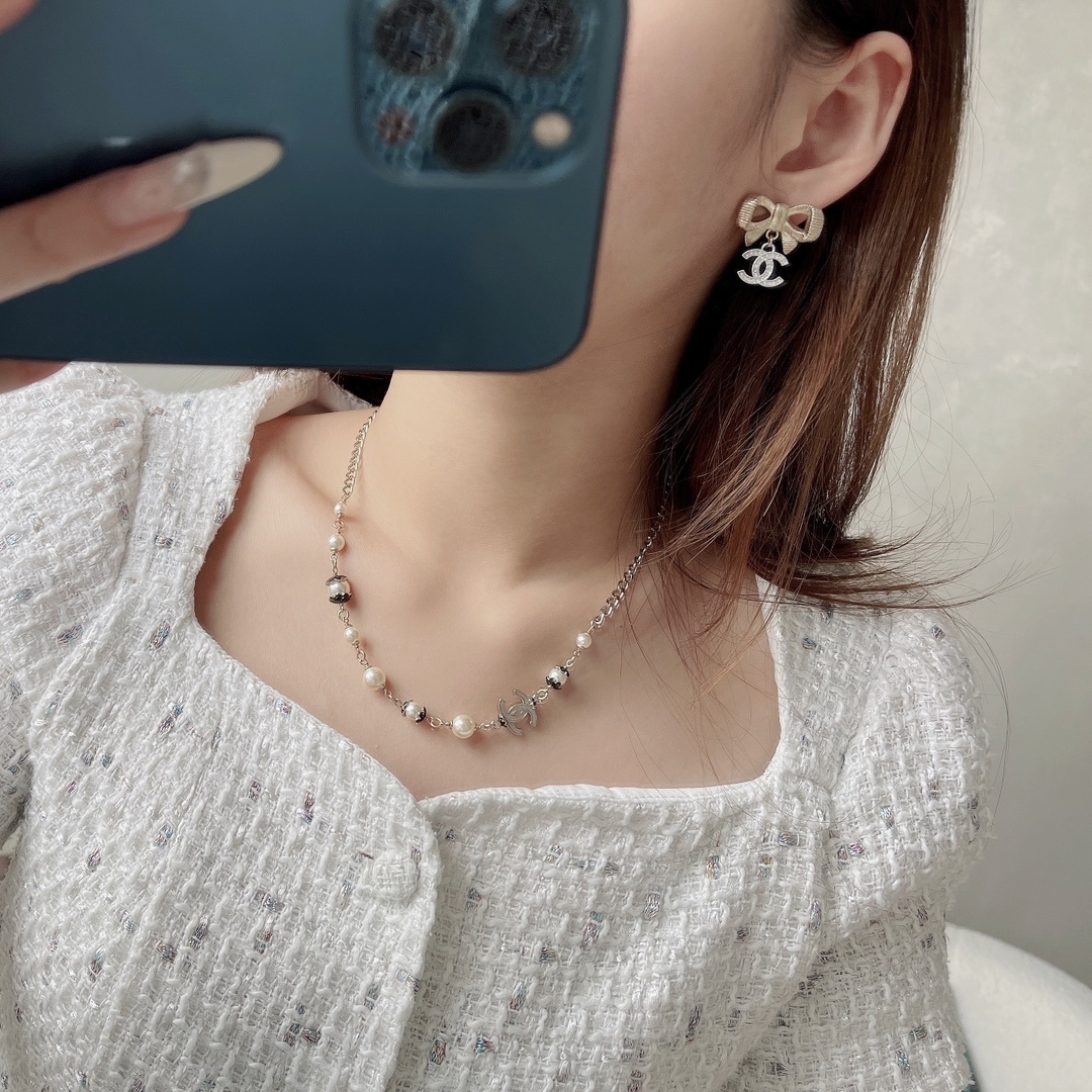 Elegant Gold Ribbon Bow Earrings with Crystal CC Dangle Charms