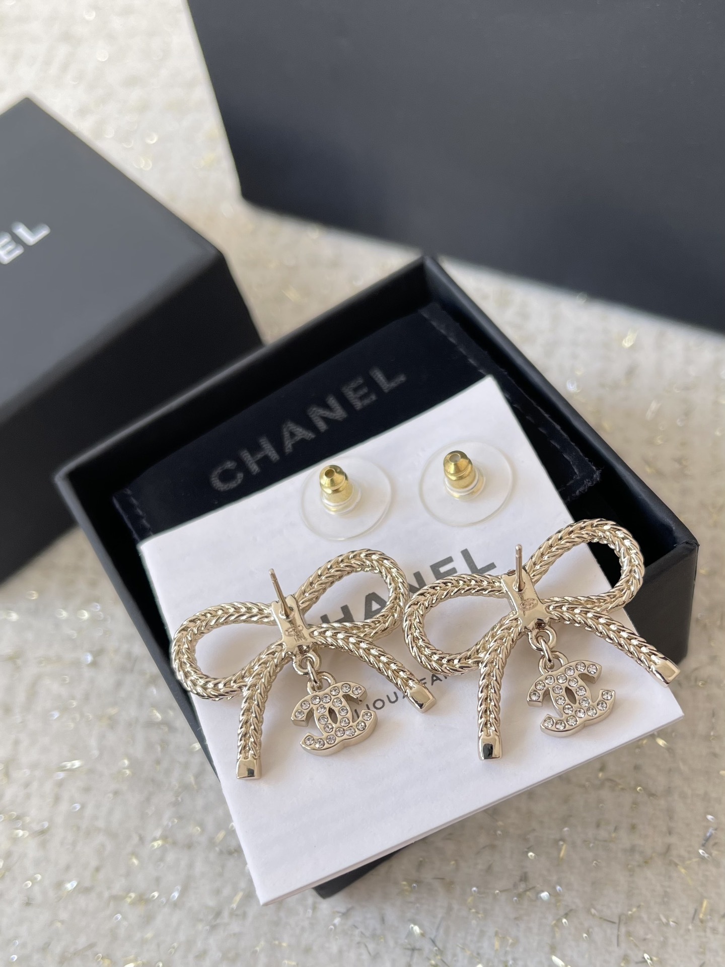 Gold Bow Stud Earrings with Crystal Logo Charm - Elegant 24B Style