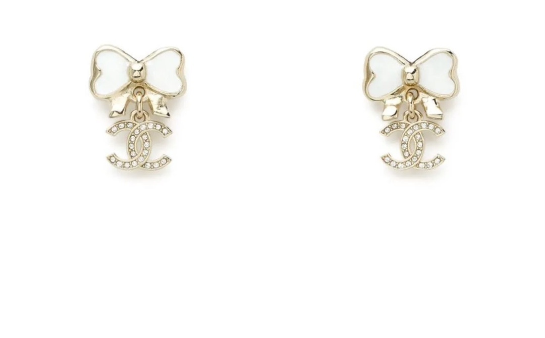 Elegant White Bow & Crystal Logo Dangle Earrings – Gold Tone