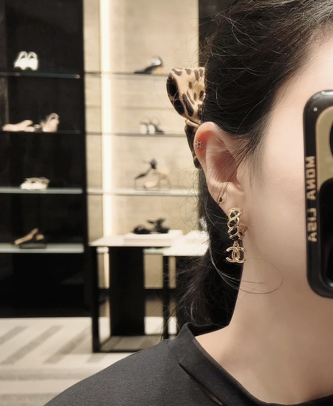 Elegant Gold-Tone CC Dangle Earrings with Interwoven Black Leather