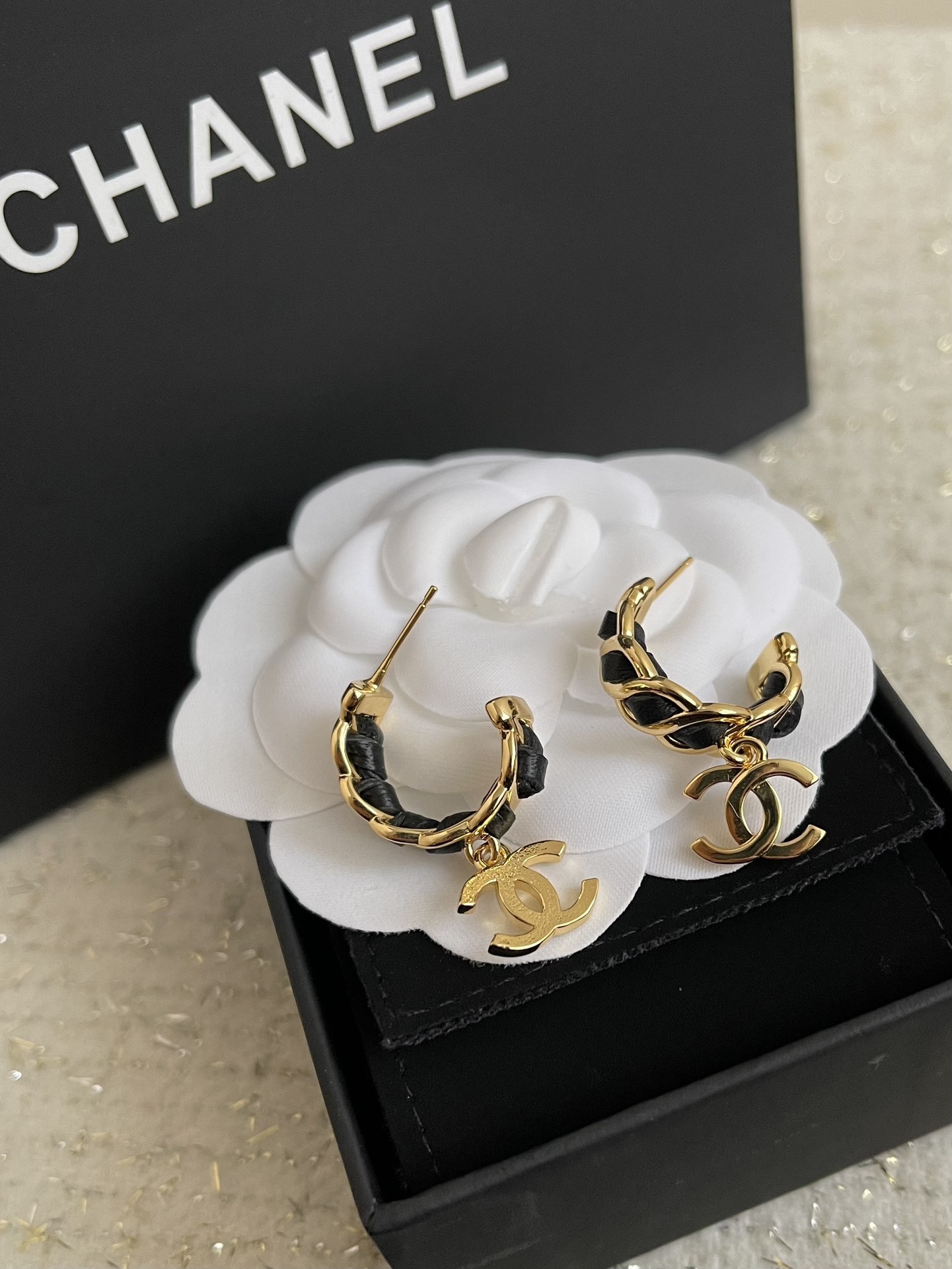 Elegant Gold-Tone CC Dangle Earrings with Interwoven Black Leather