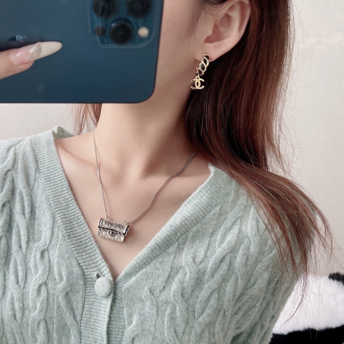 Elegant Gold-Tone CC Dangle Earrings with Interwoven Black Leather