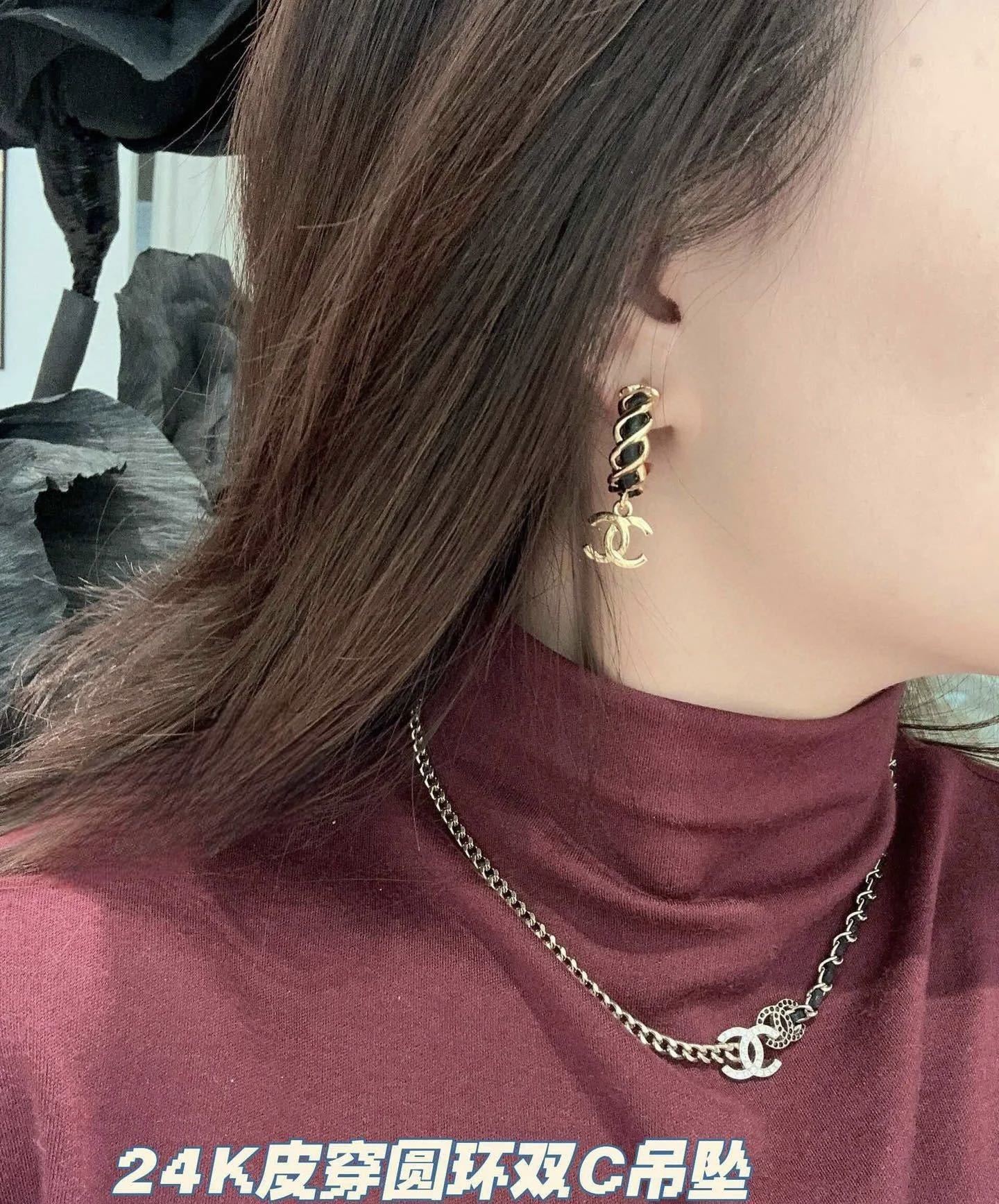 Elegant Gold-Tone CC Dangle Earrings with Interwoven Black Leather