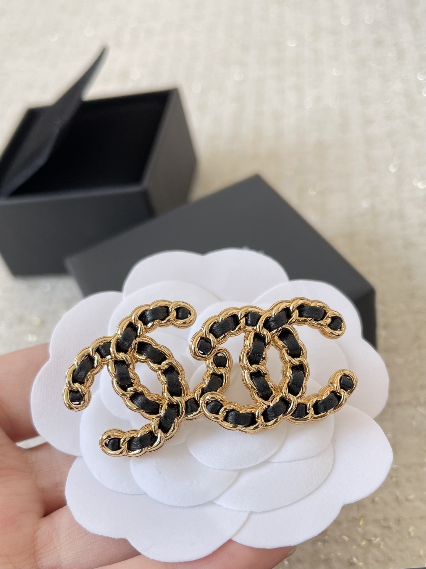 Elegant CC Logo Stud Earrings with Gold Metal and Black Leather