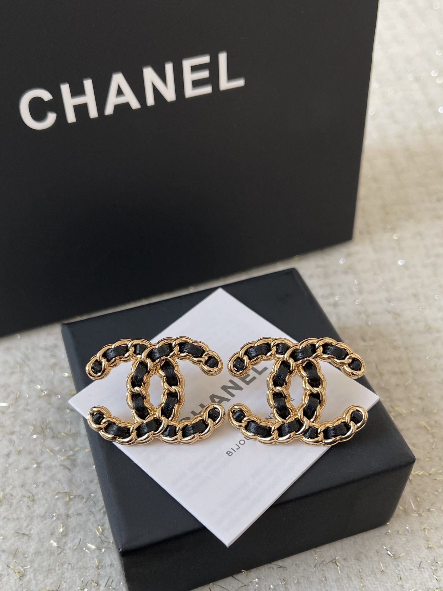 Elegant CC Logo Stud Earrings with Gold Metal and Black Leather