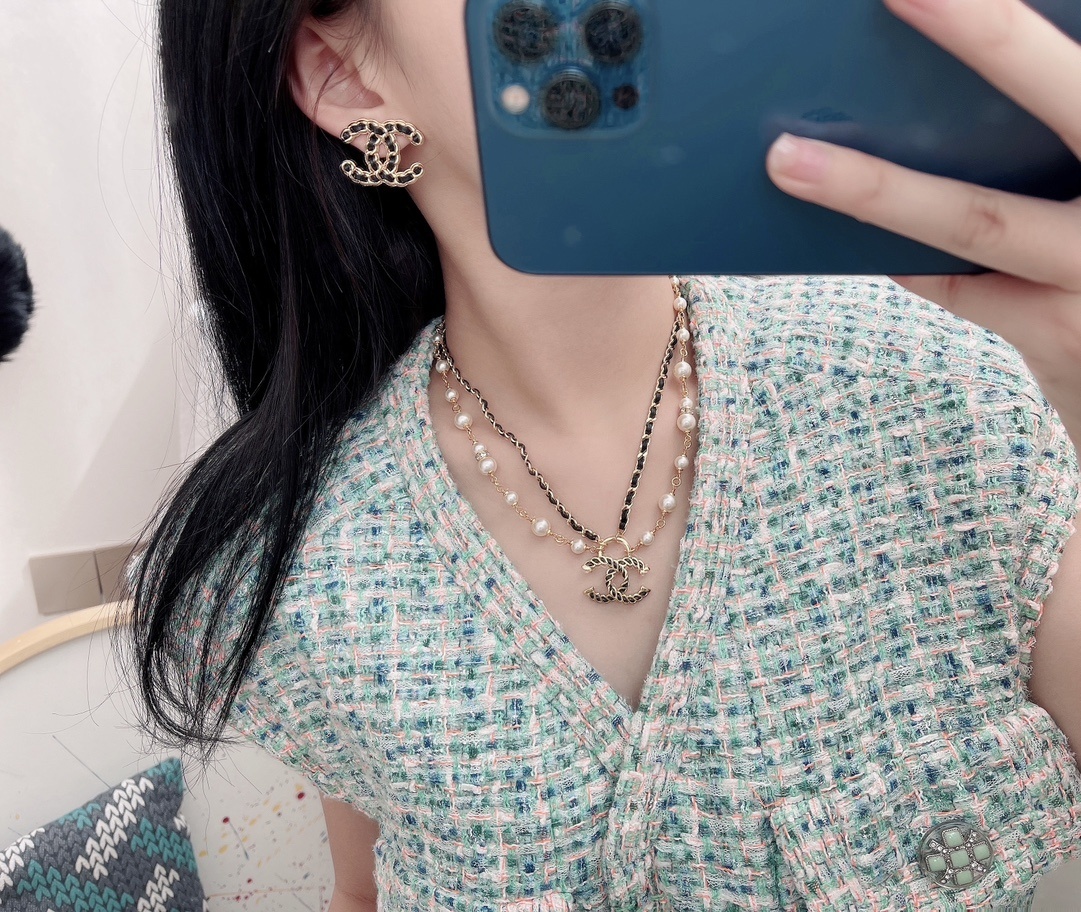 Elegant CC Logo Stud Earrings with Gold Metal and Black Leather