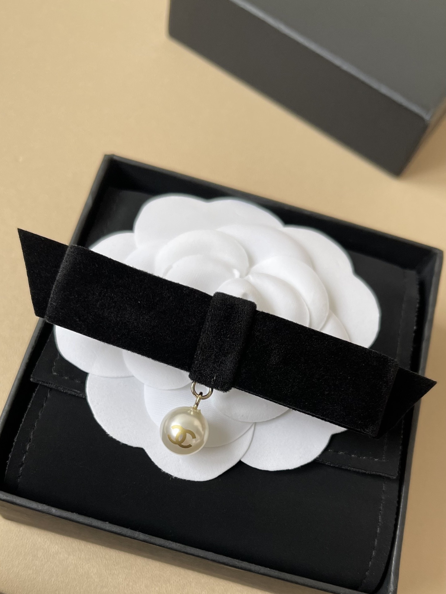 Elegant Chanel Black Velvet Bow Hair Clip with CC Pearl Drop