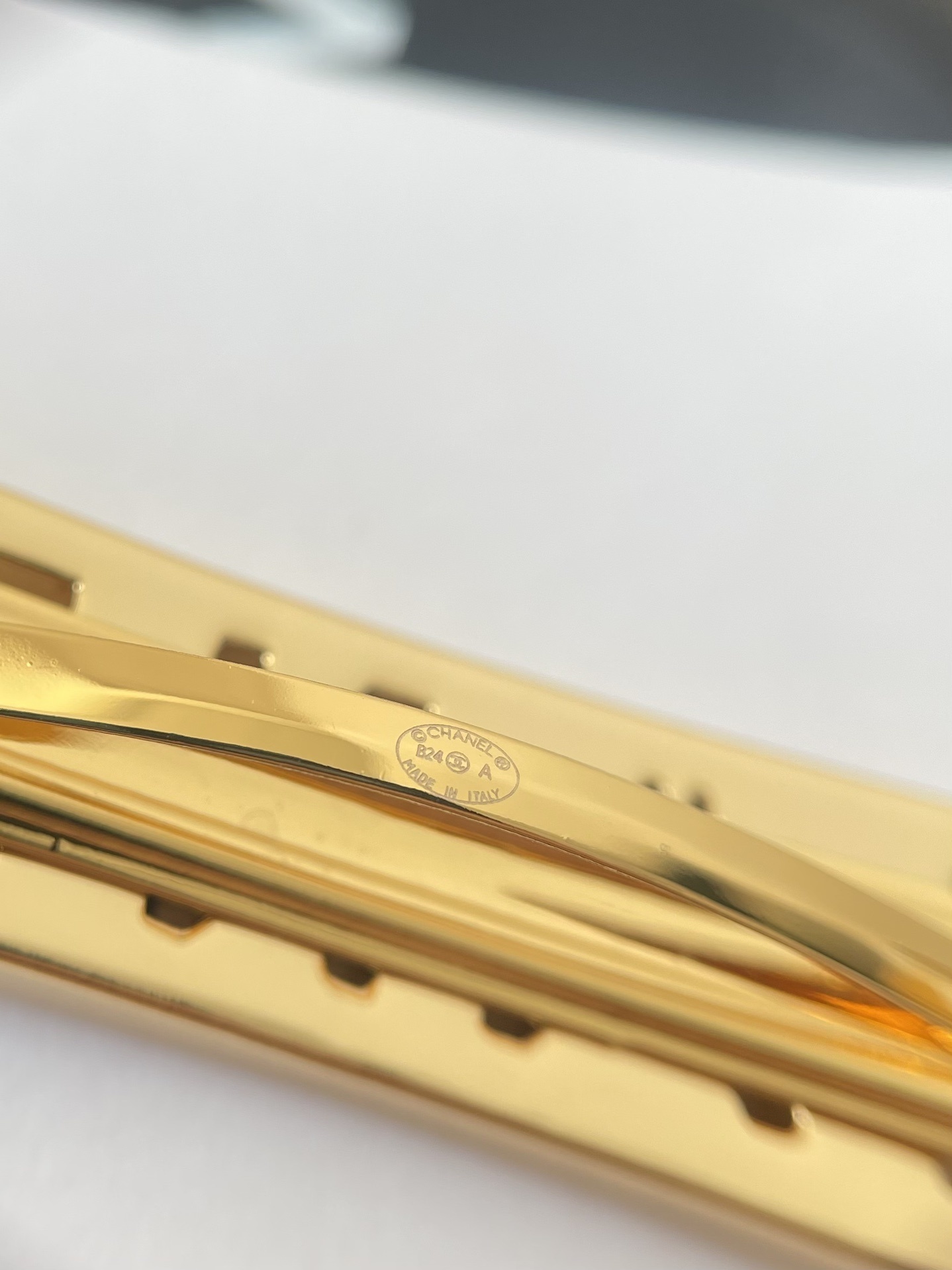 Elegant Chanel Gold Hair Barrette with White Enamel Lettering