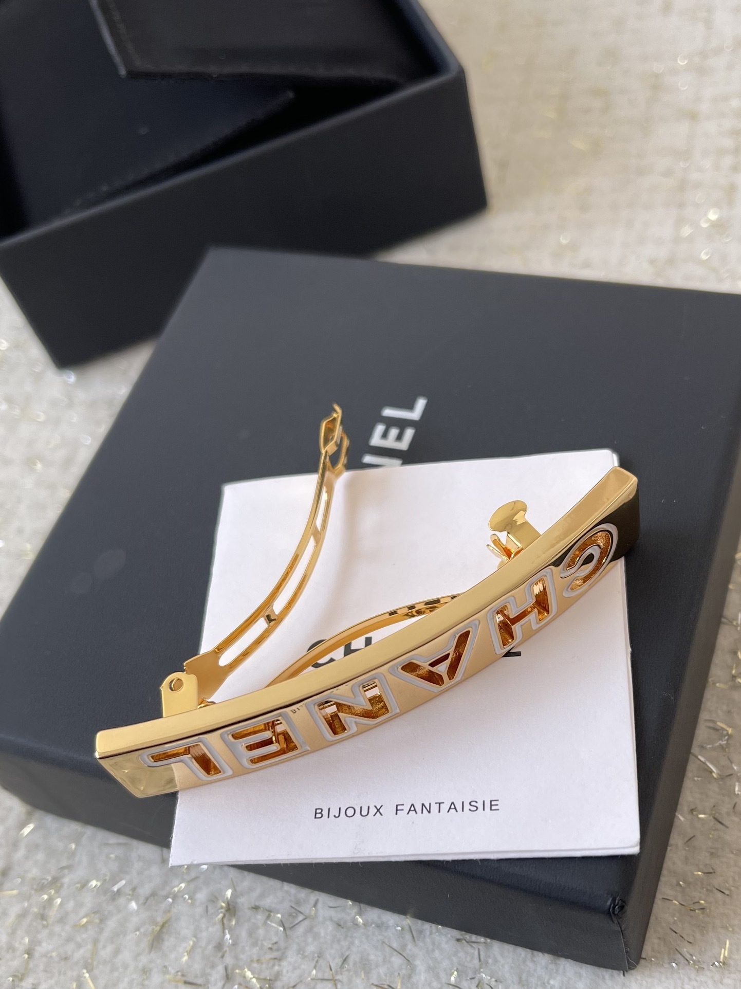 Elegant Chanel Gold Hair Barrette with White Enamel Lettering