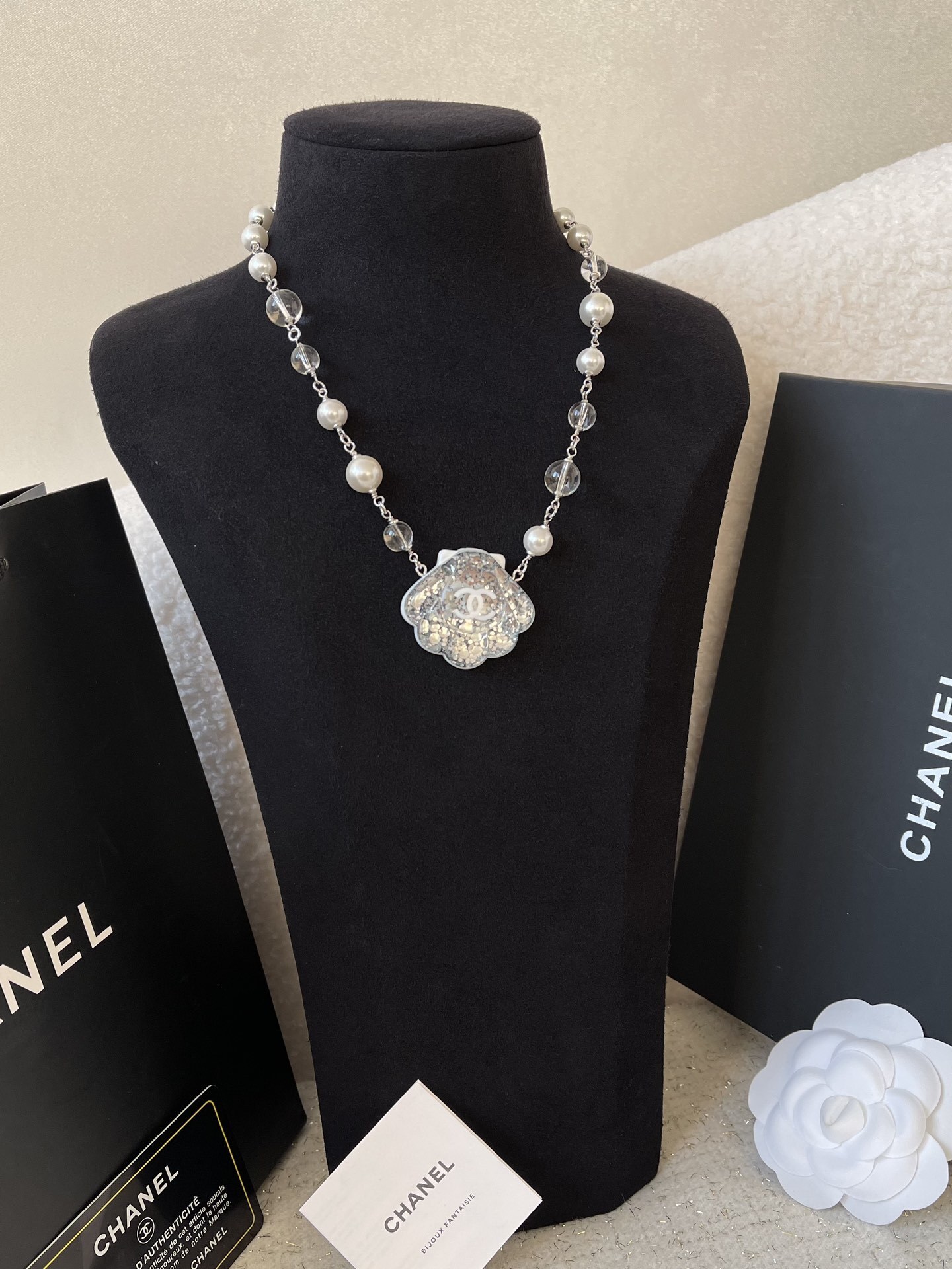 Elegant Pearl Necklace with Glitter Shell Pendant and CC Logo