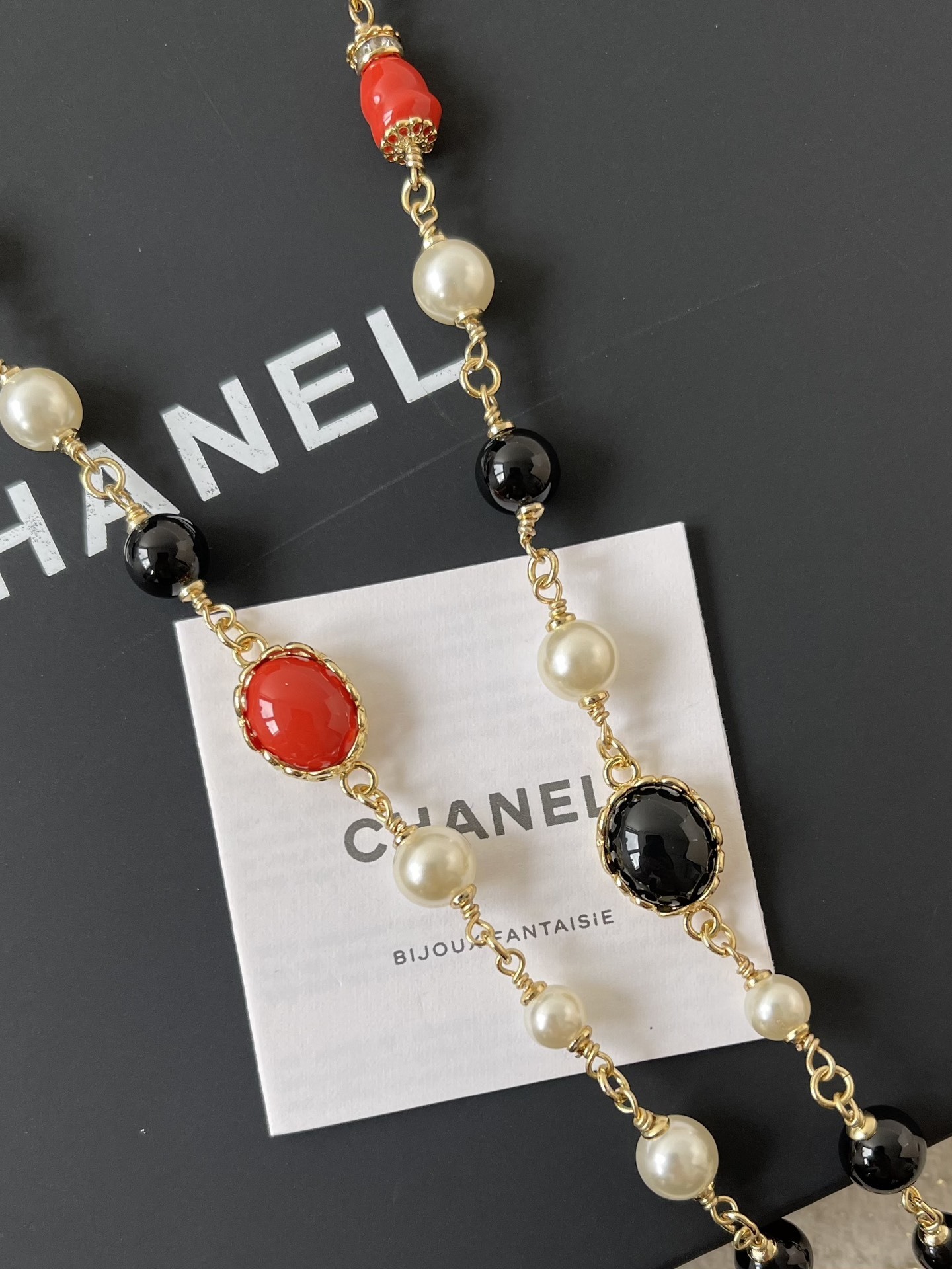 Elegant Gold CC Pearl Long Necklace - Red & Black Bead Detail