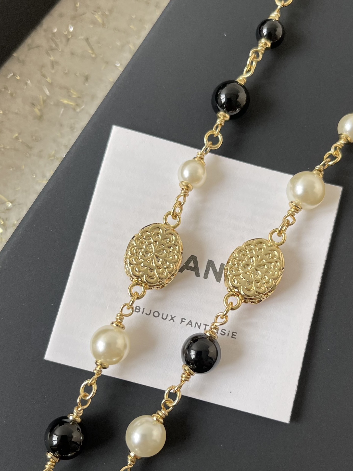 Elegant Gold CC Pearl Long Necklace - Red & Black Bead Detail
