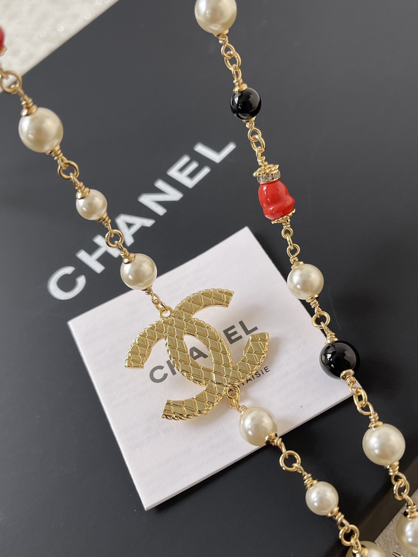 Elegant Gold CC Pearl Long Necklace - Red & Black Bead Detail