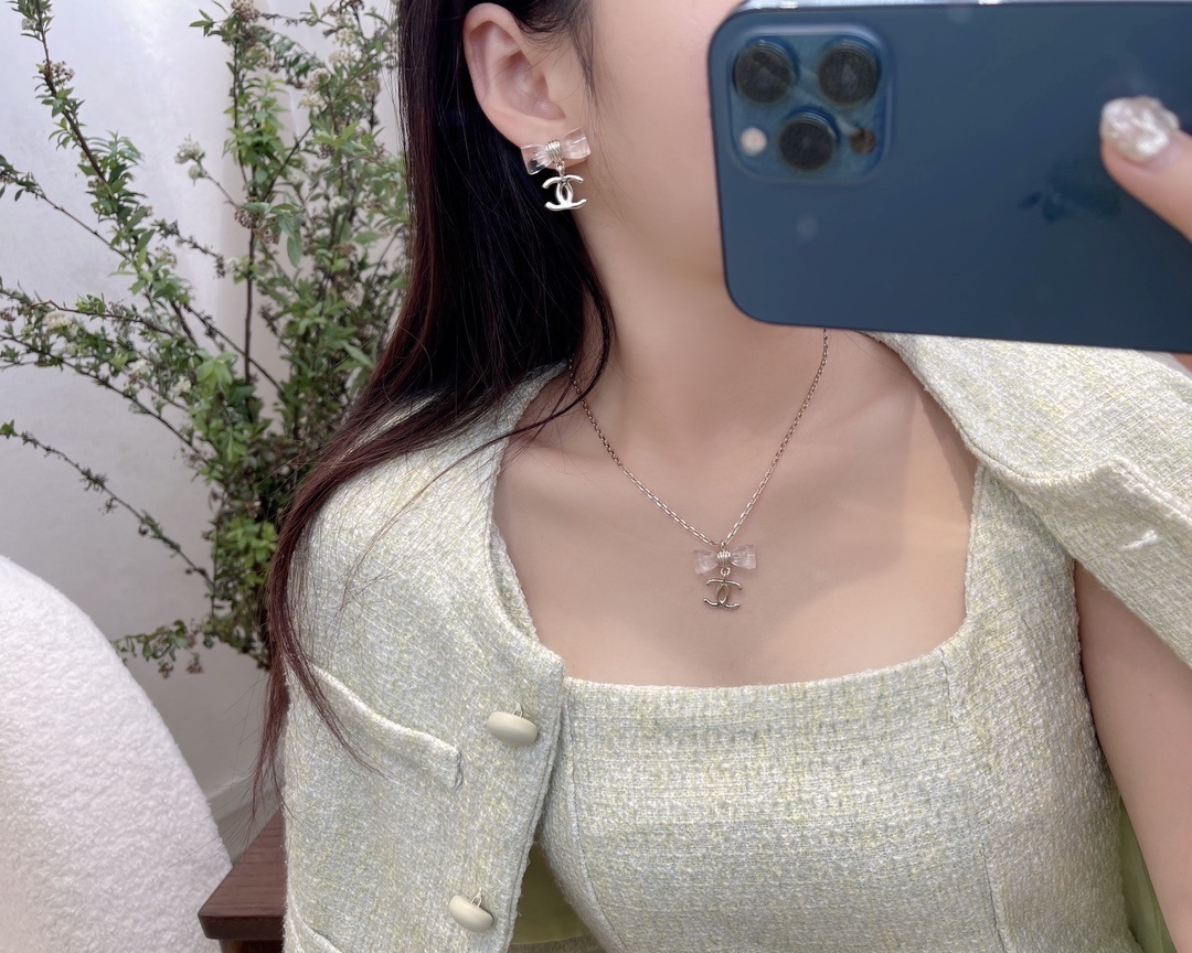 Elegant Gold-Tone Crystal Bow & CC Logo Pendant Necklace