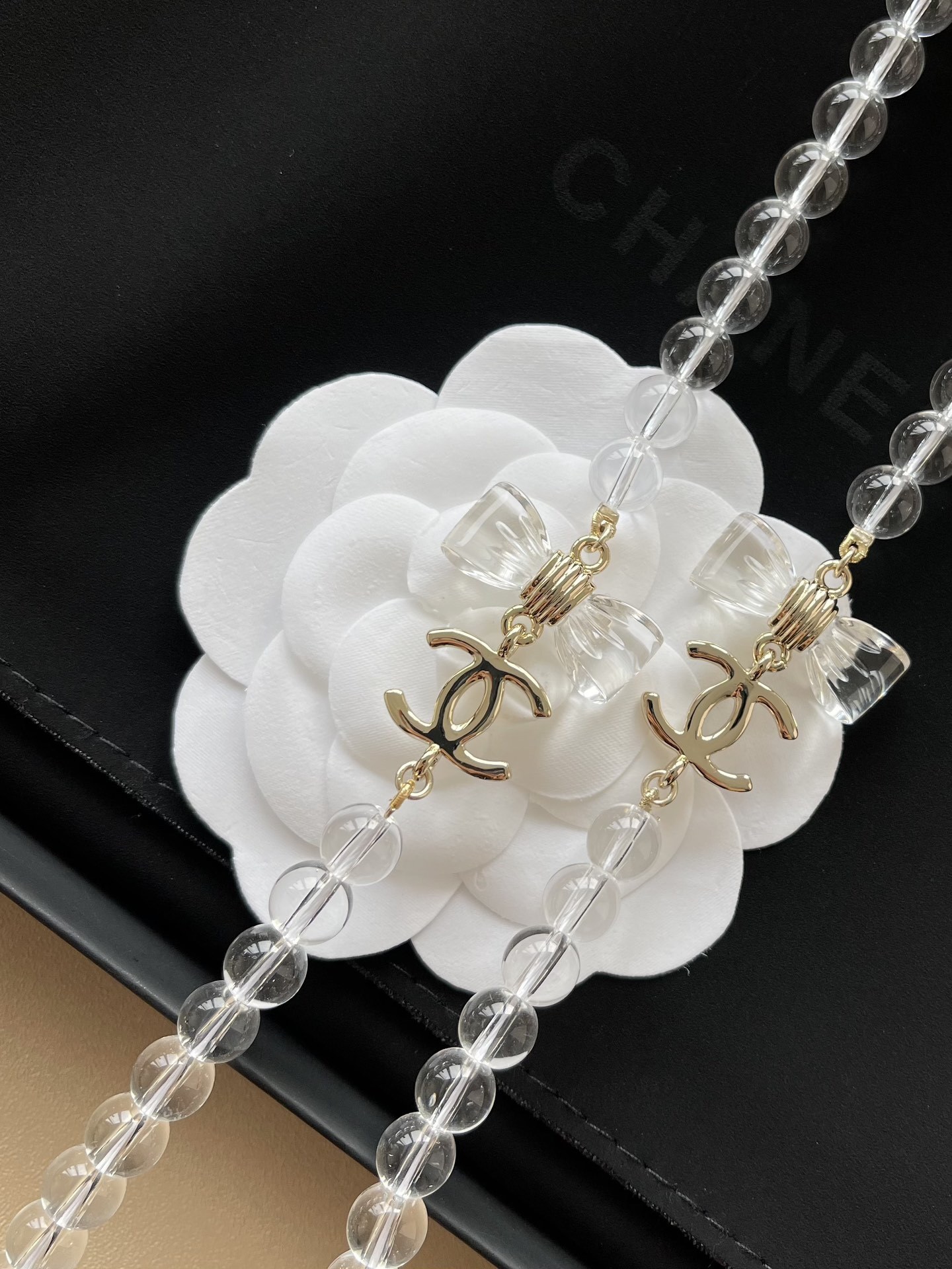 Luxury Chanel Clear Beaded Long Necklace with CC Logo and Bows