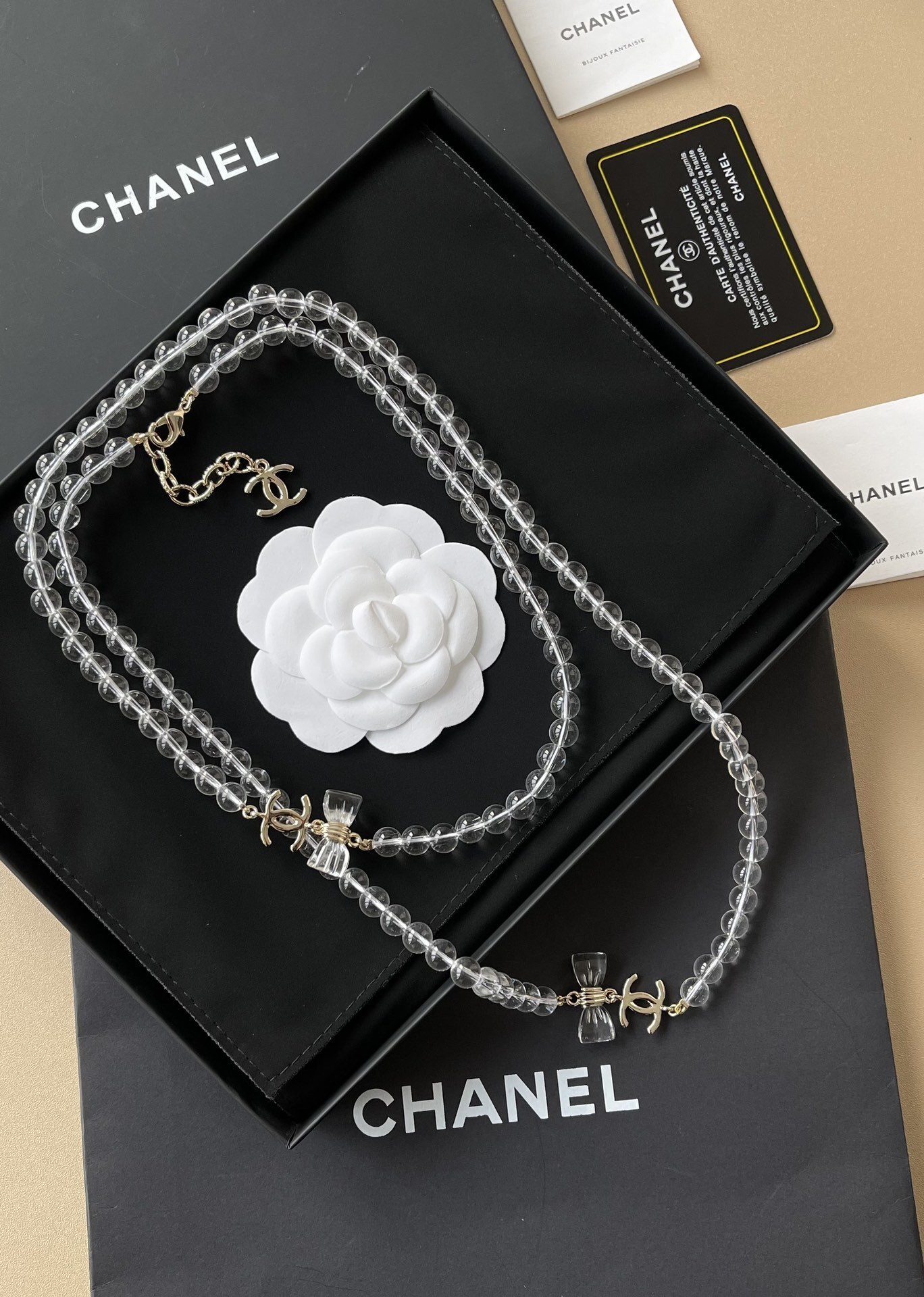 Luxury Chanel Clear Beaded Long Necklace with CC Logo and Bows