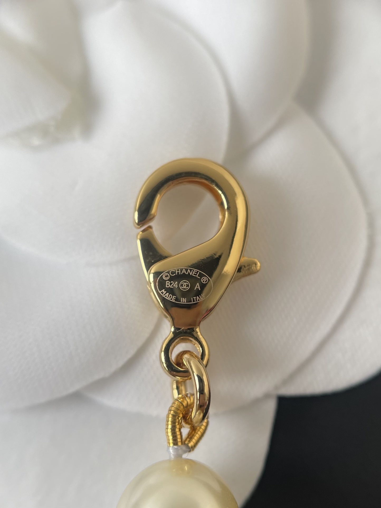 Elegant Long Pearl Necklace with Gold Safety Pin Logo Pendant