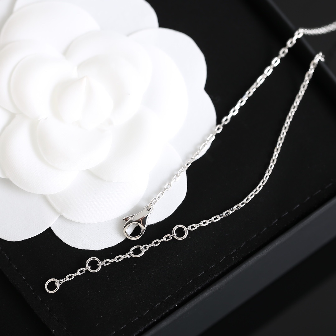 Elegant Chanel Bow Ribbon Crystal Pavé Necklace in Silver