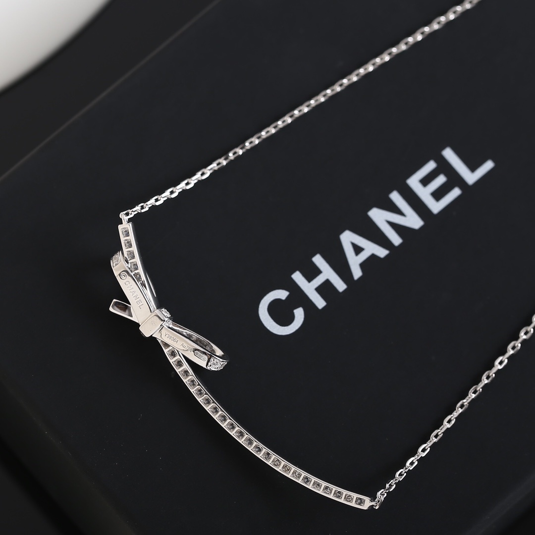 Elegant Chanel Bow Ribbon Crystal Pavé Necklace in Silver