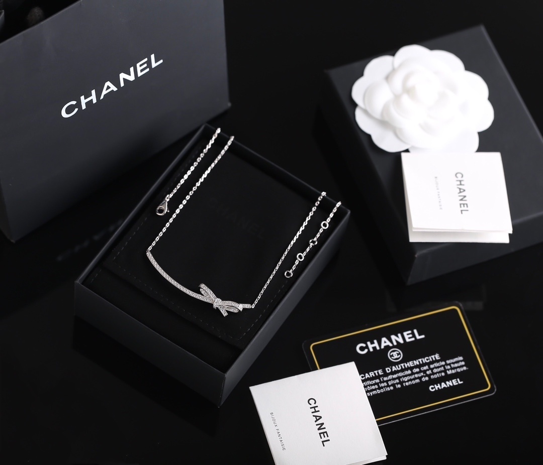 Elegant Chanel Bow Ribbon Crystal Pavé Necklace in Silver