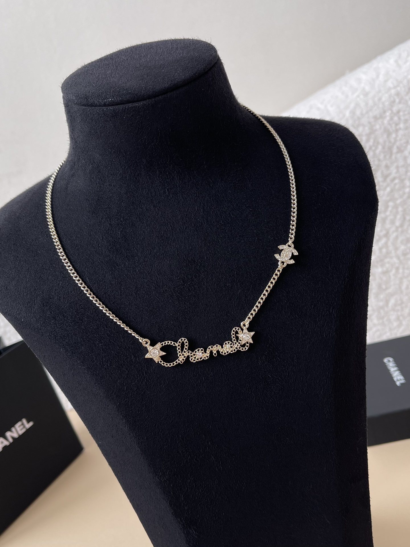 Chanel Gold-Tone Crystal Script Logo & Star Charm Necklace