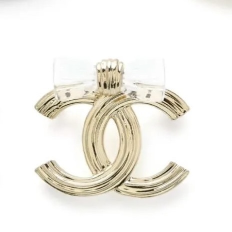 Elegant Gold-Tone CC Interlocking Brooch with Transparent Bow