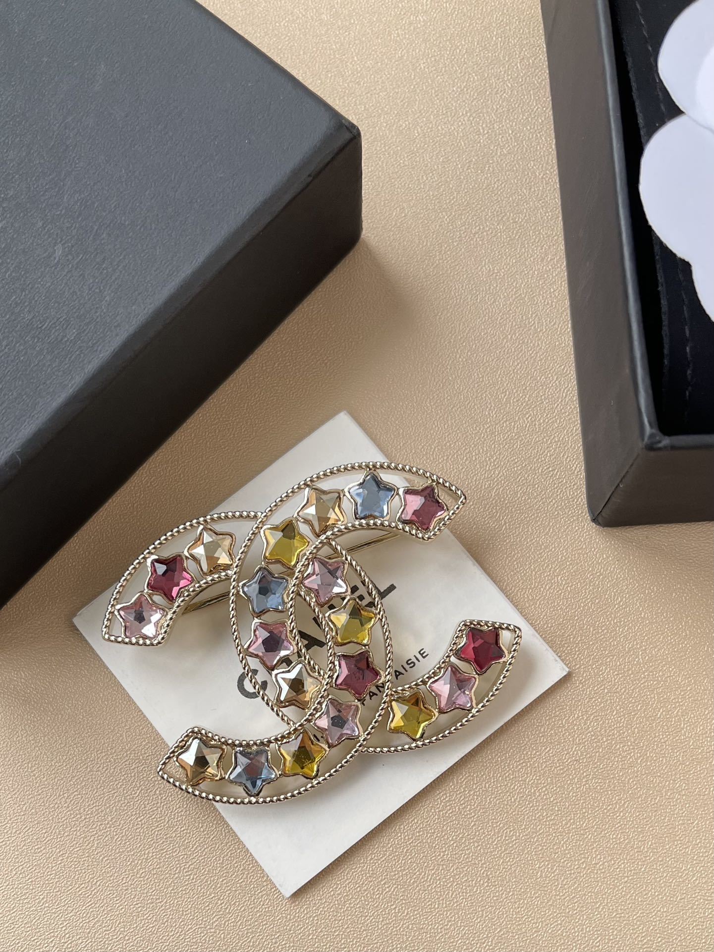 Elegant Gold CC Brooch with Multi-Color Star Crystals