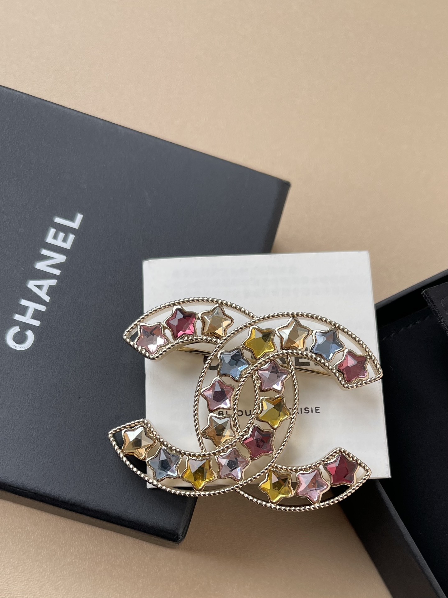Elegant Gold CC Brooch with Multi-Color Star Crystals